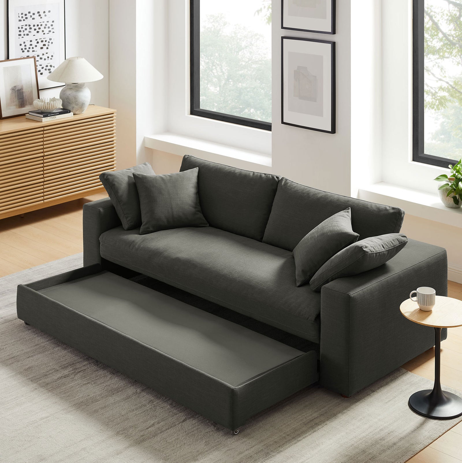 Gray Commix sleeper sofa with pull-out base partially extended in a contemporary living space || EEI-7080-GRY || front_angle_converted_room