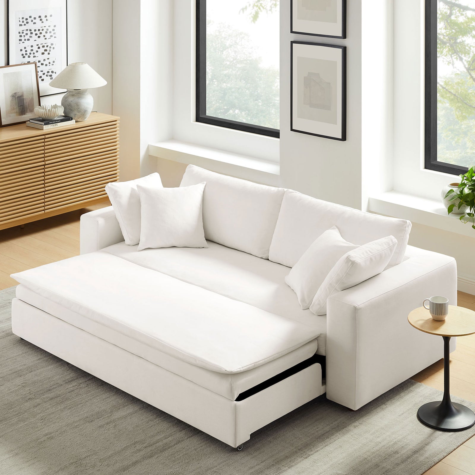 White cushion unfolds over the extended base to form a smooth sleeping surface on the sofa bed || EEI-7080-PUW || front_angle_converted_room