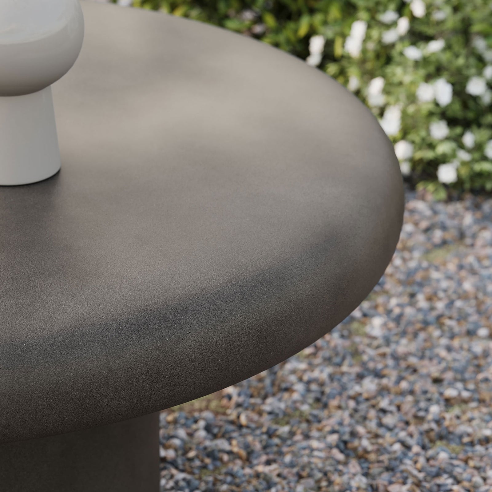 Gray concrete tabletop with subtle speckled finish bringing a modern stone look to outdoor lounging spaces || EEI-7092-GRY || detail_room