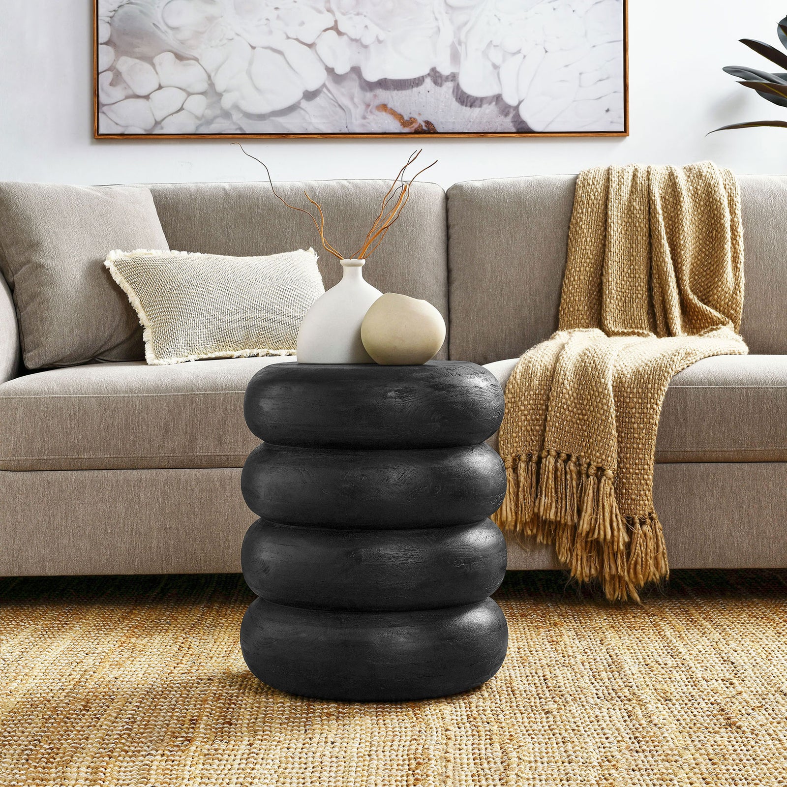 Black stacked wood side table styled with neutral decor in cozy living room || EEI-7106-BLK || front_angle_room