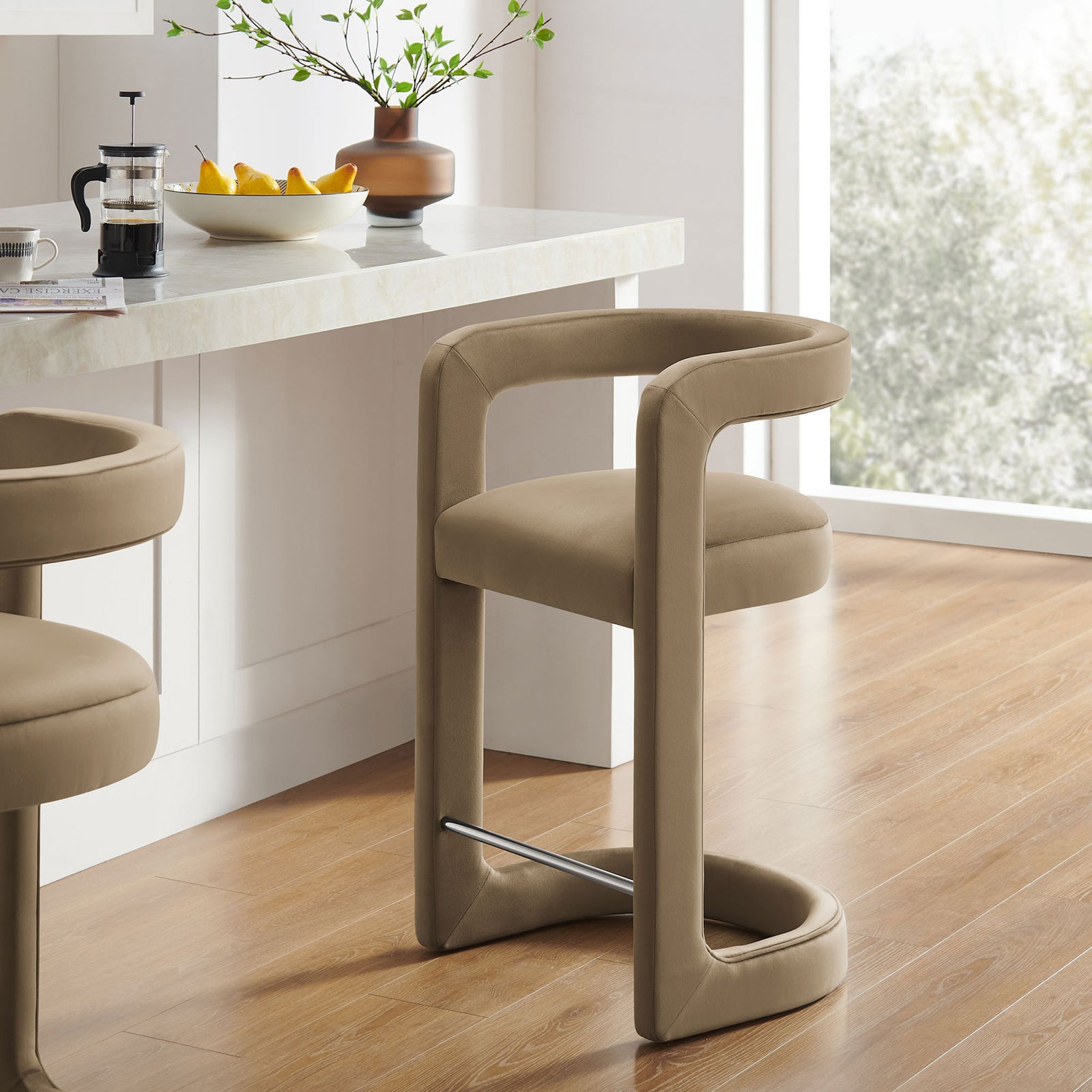Elevate your kitchen with this taupe velvet counter stool and chic stainless steel footrest || EEI-7107-TAU || front_angle_room