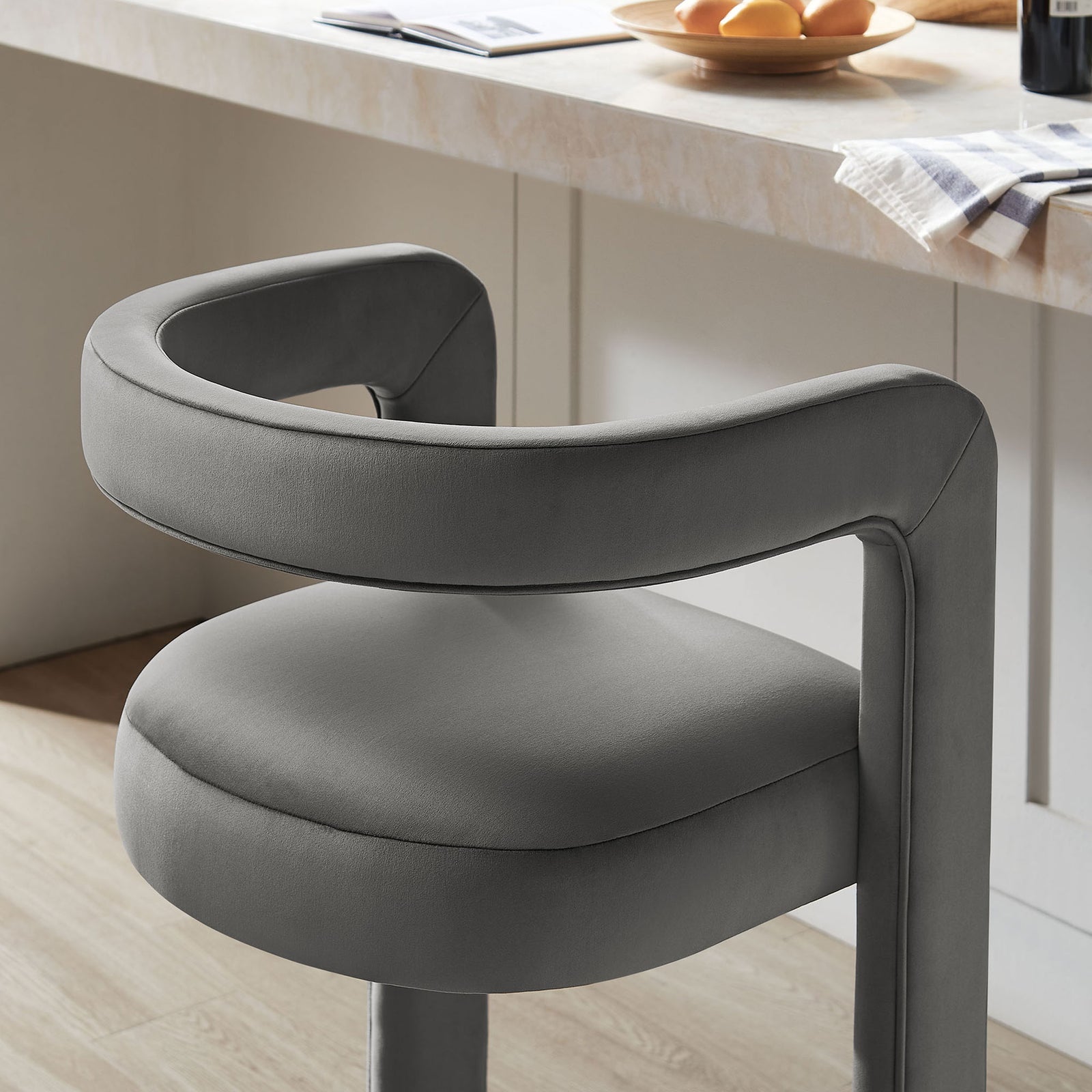 Velvety texture and curved arm lend cozy sophistication to the home bar || EEI-7108-STG || detail_room