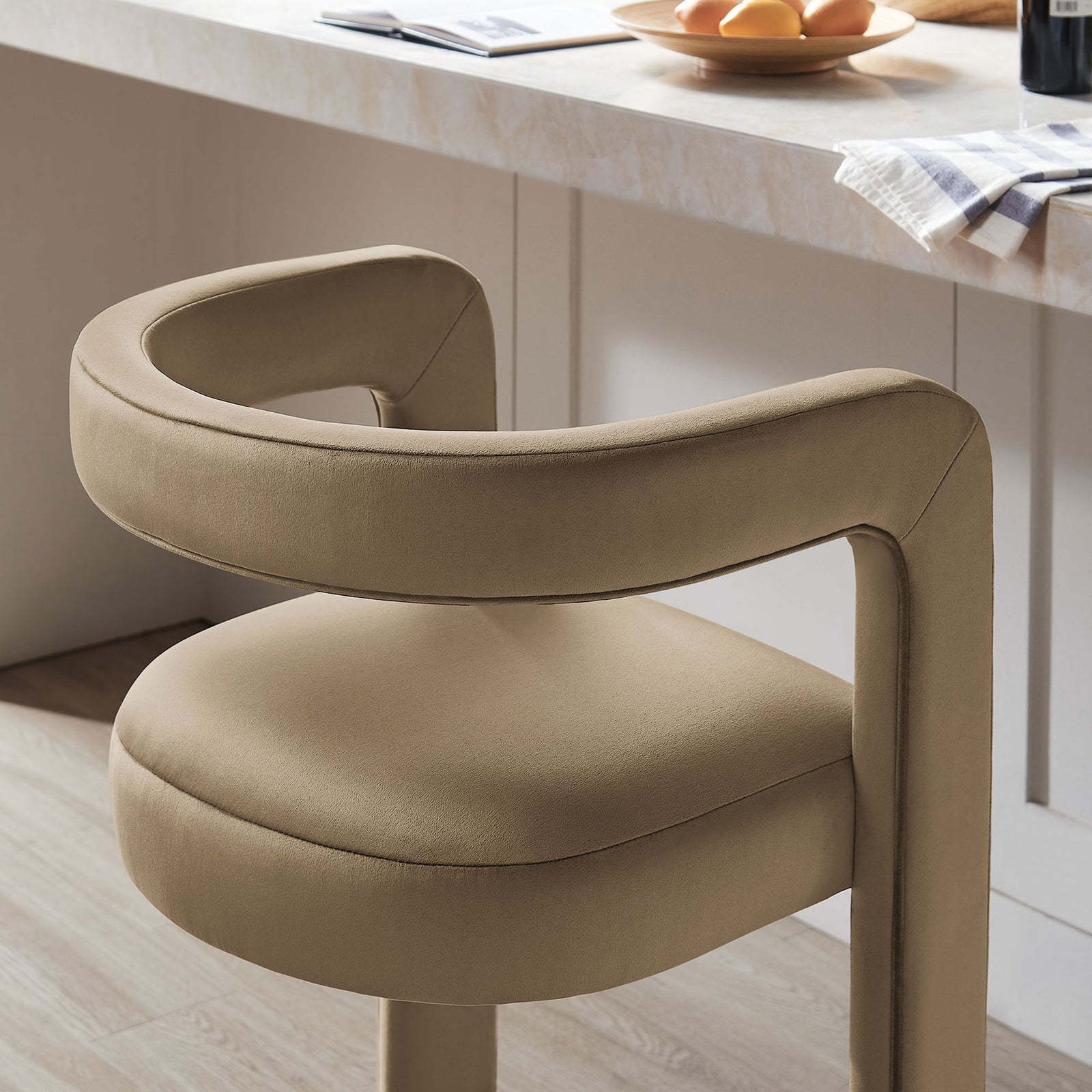 Textured velvet and rounded backrest bring a soft touch to the bar seating area || EEI-7108-TAU || detail_room