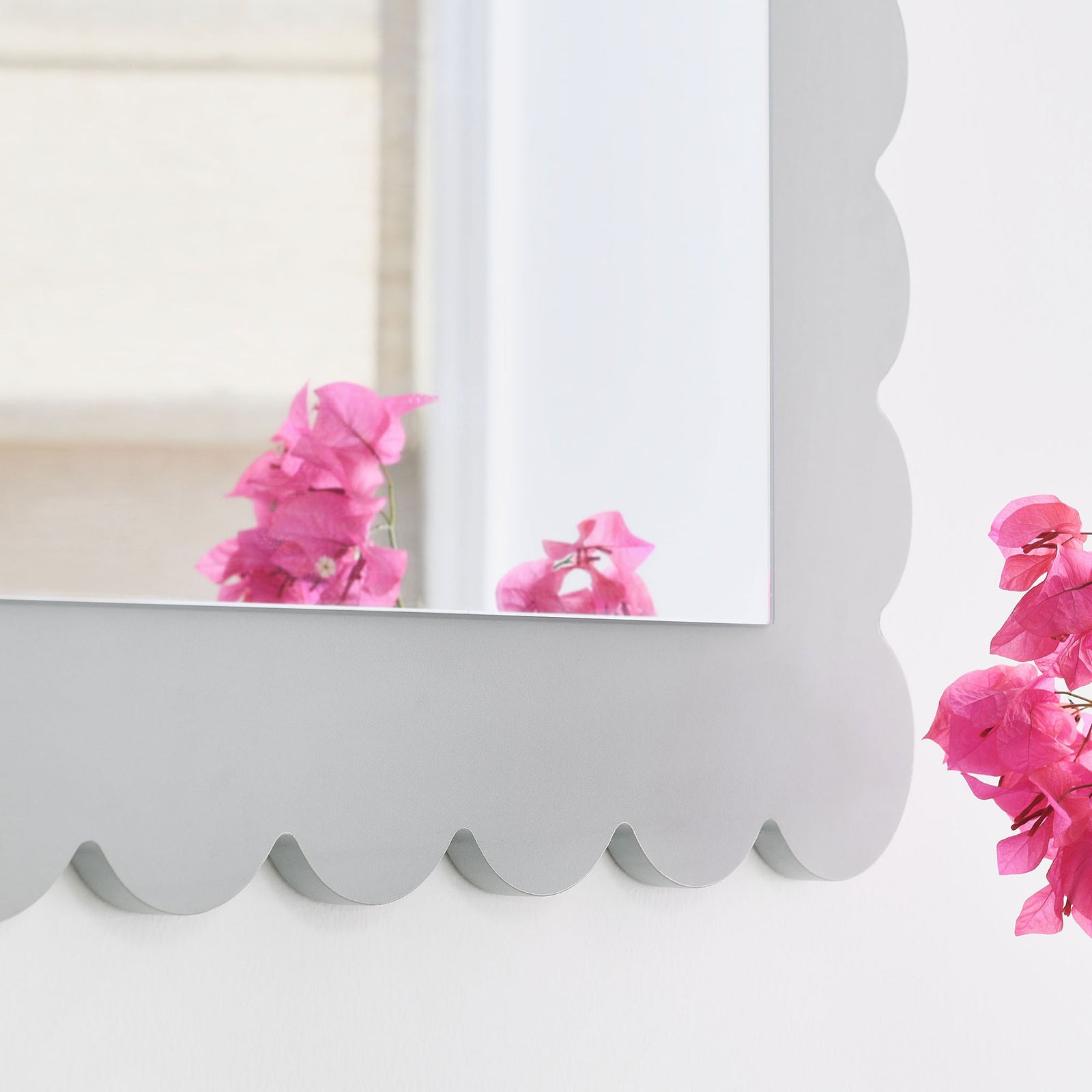 Detail of the light gray scalloped edge adding a playful touch beside bright flowers || EEI-7116-LGR || detail_room
