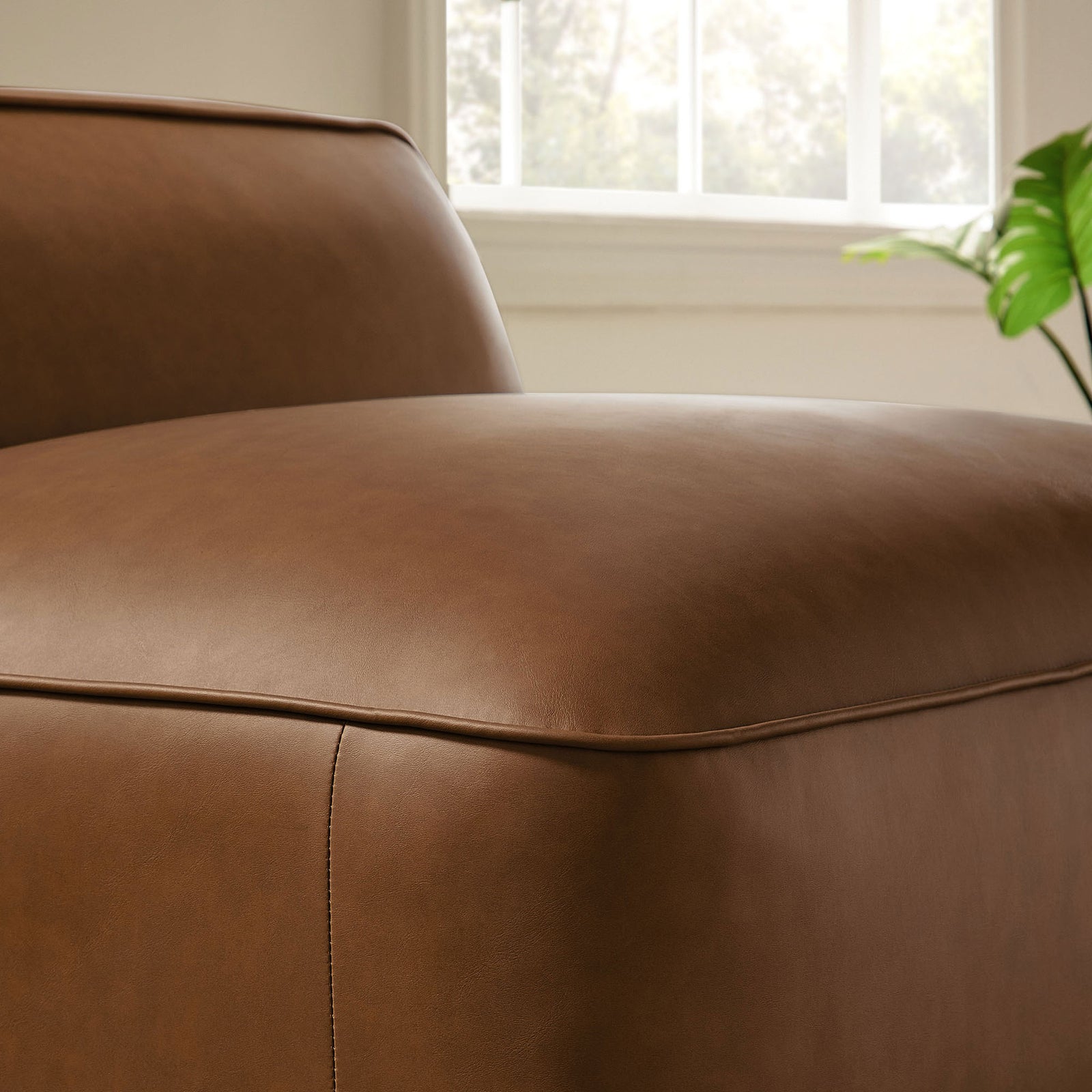 Plush cushioning and smooth vegan leather invite relaxed lounging in any space || EEI-7121-COF || detail_room