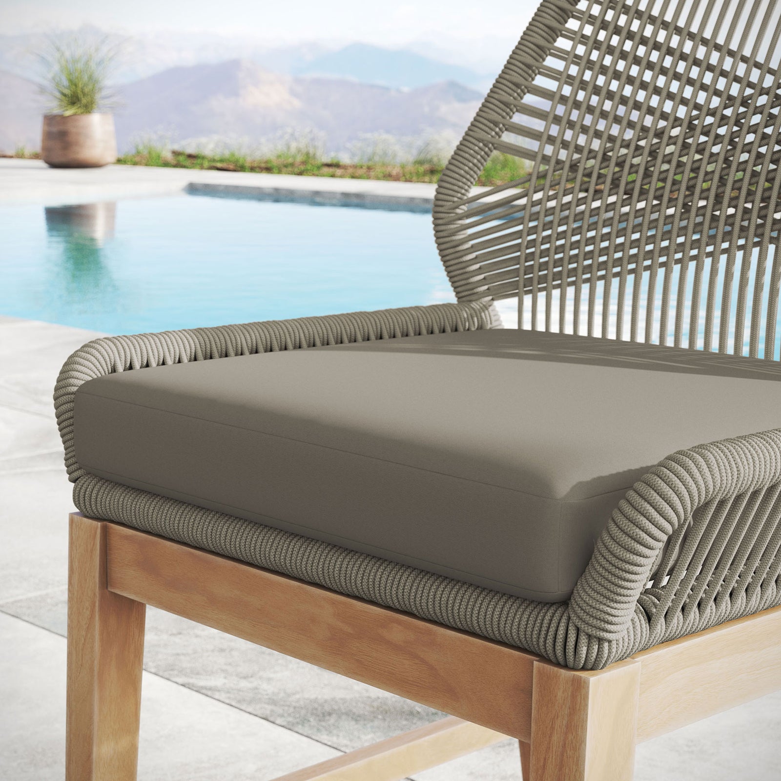 Cushioned counter stool seat with light greige rope frame shown in a tranquil outdoor poolside setting. || EEI-7126-LGR-GRG || detail_room