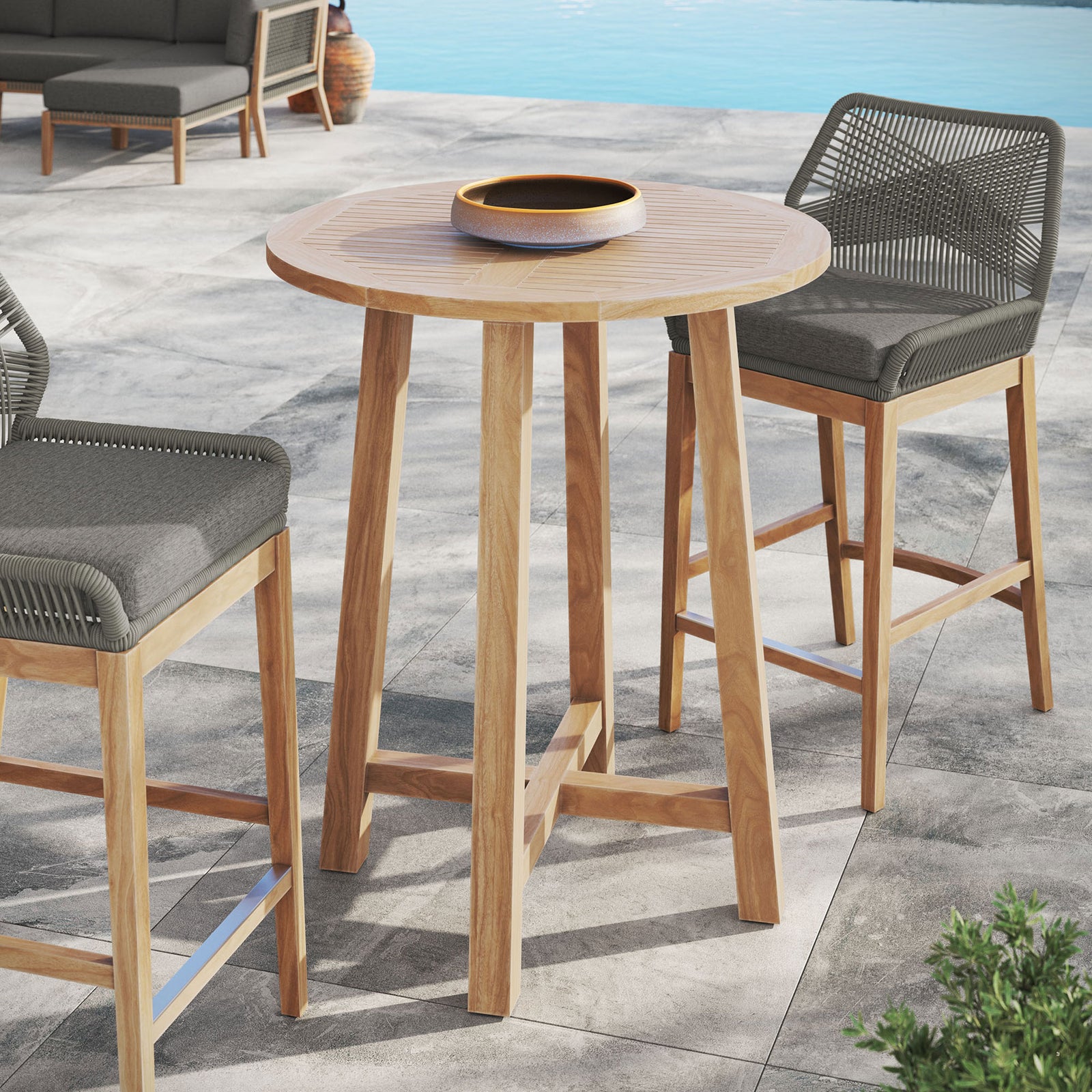 Teak bar table pairs effortlessly with counter stools to create a relaxed poolside entertaining nook || EEI-7127-NAT || front_angle_room