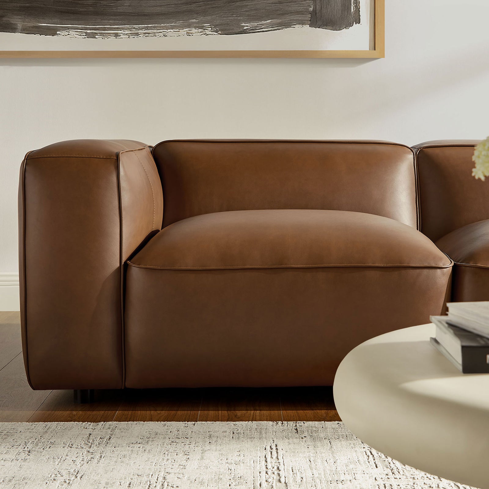 Single Auren modular seat in coffee vegan leather with generous cushioning and tailored seams || EEI-7129-COF || detail_room
