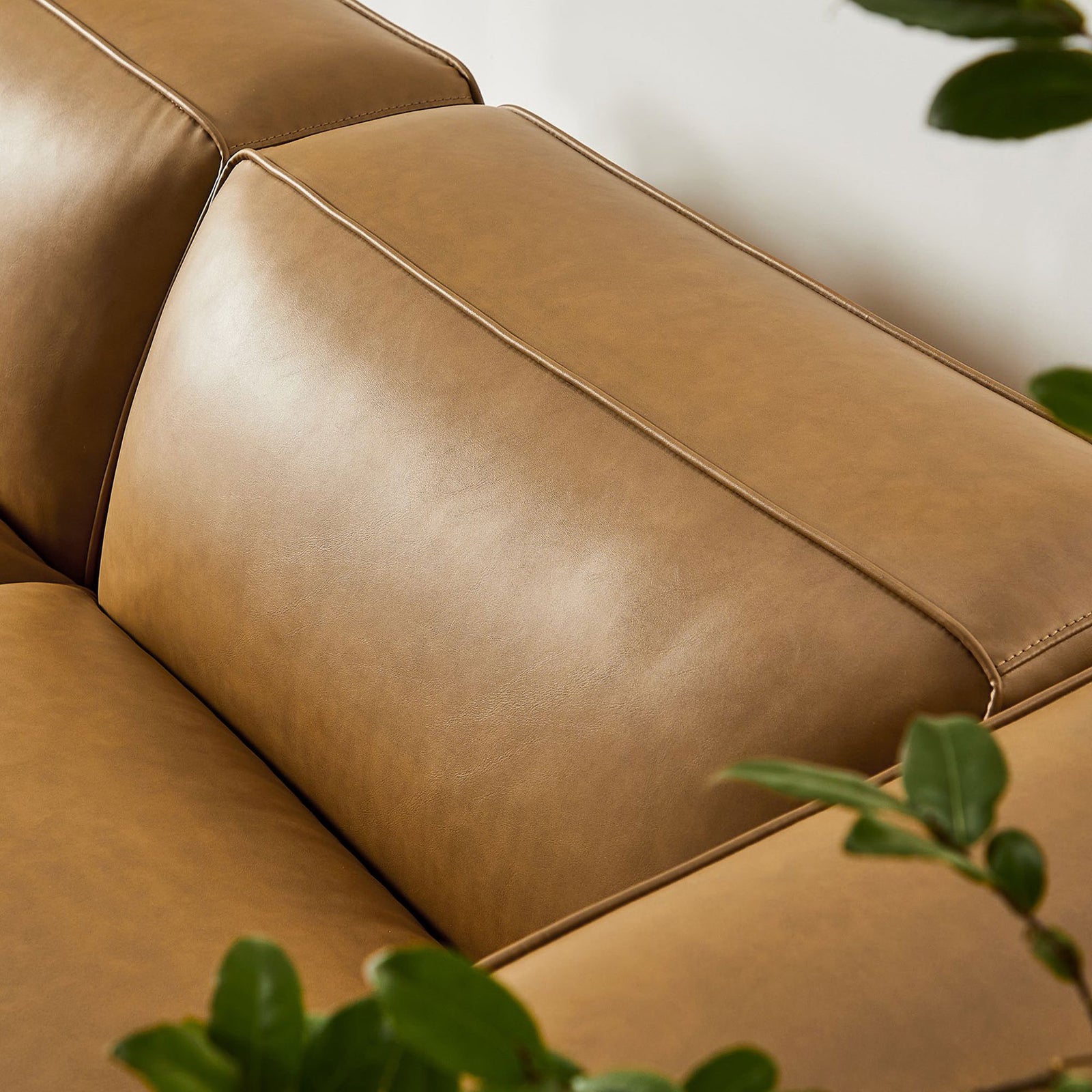 Close-up of camel vegan leather cushions with tailored stitching detail || EEI-7130-CAM || detail_room