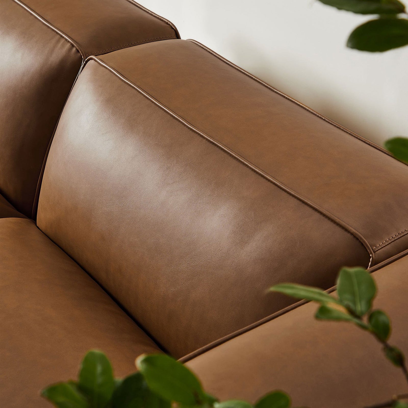 Plush coffee vegan leather seat and back cushion with tailored stitching for a refined modern look || EEI-7130-COF || detail_room
