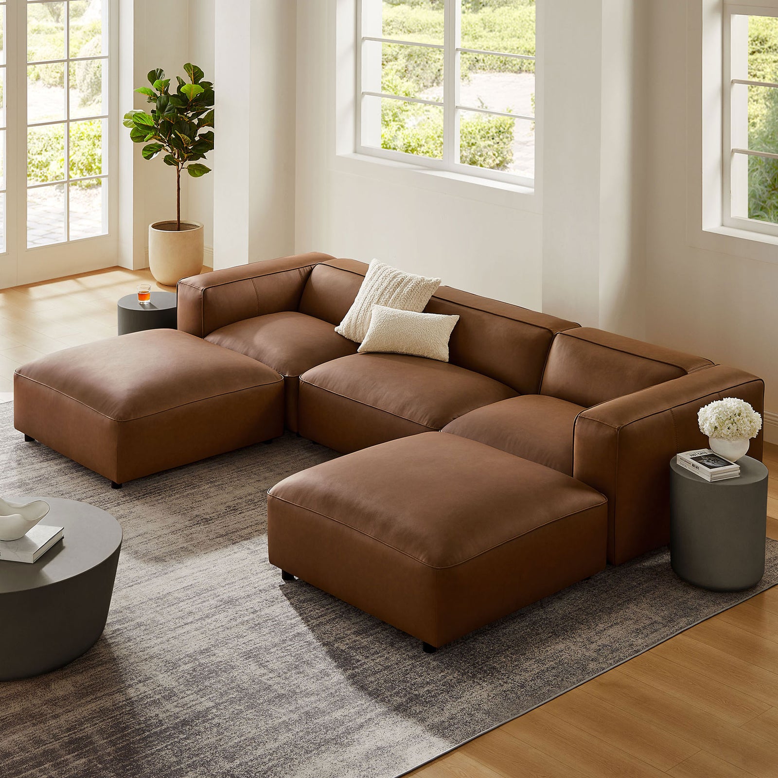 Coffee vegan leather modular sectional sofa styled in a bright modern living room with neutral decor || EEI-7131-COF || front_angle_room