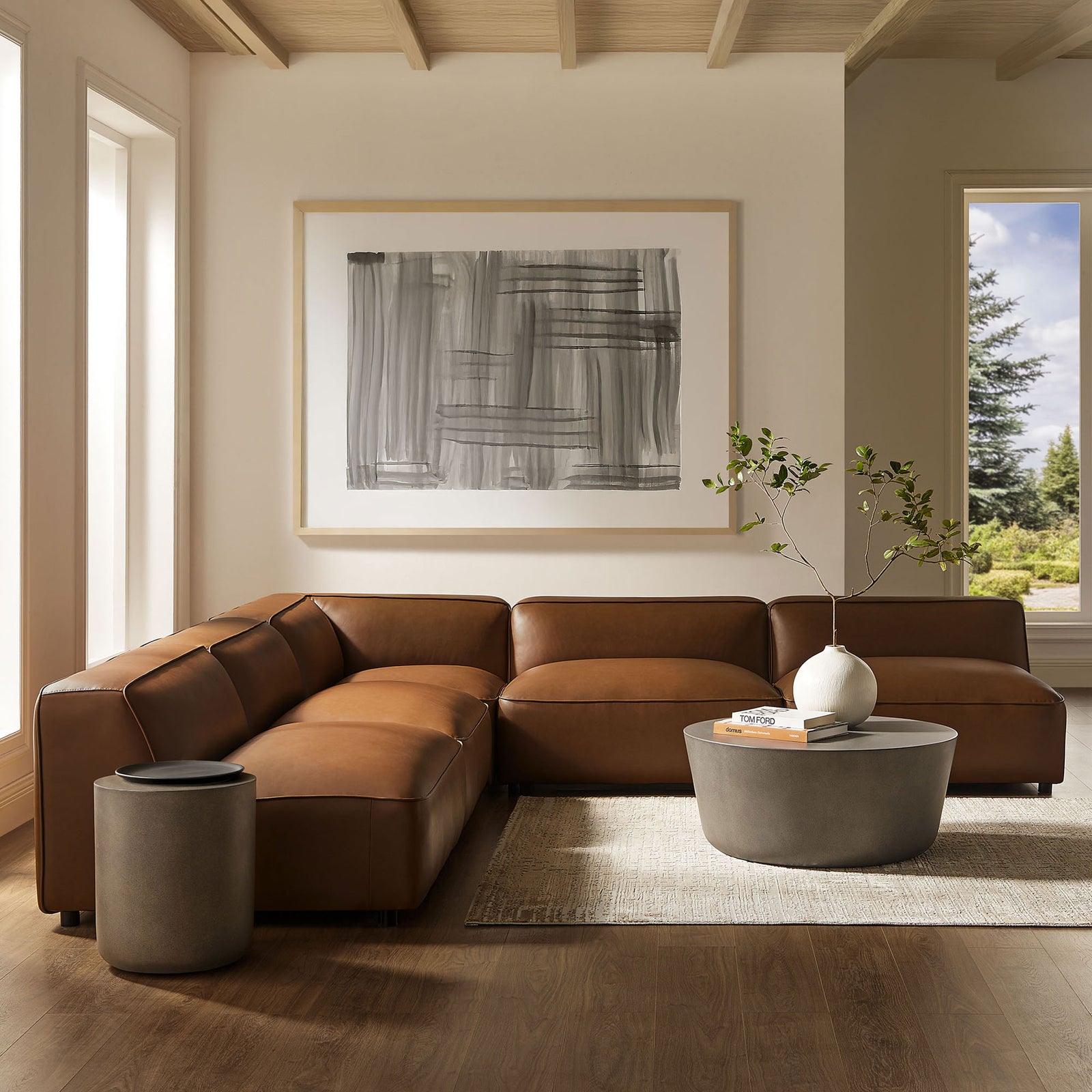 Auren L-shaped coffee vegan leather modular sofa styled in a bright living room with cozy modern decor. || EEI-7133-COF || front_angle_room