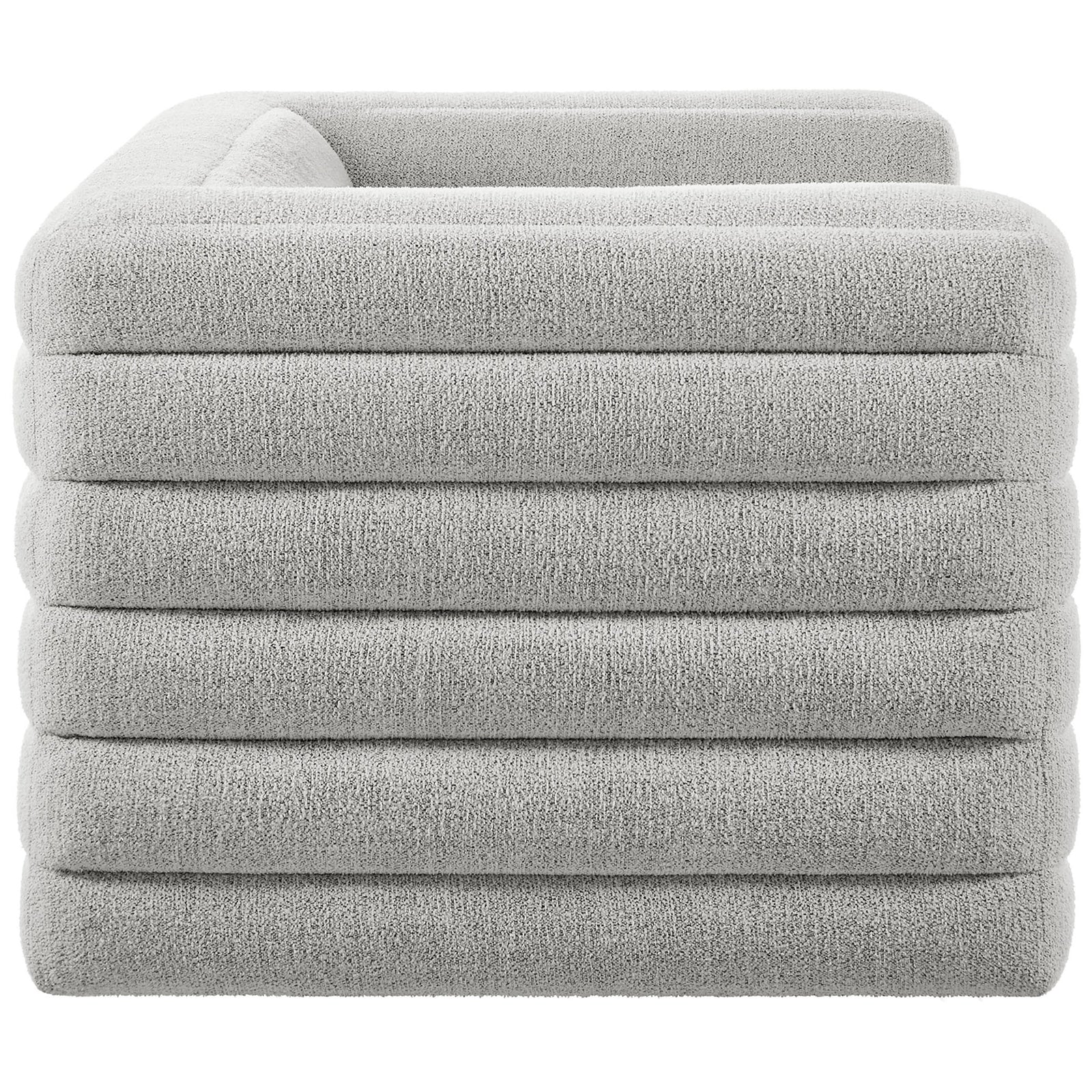 Side profile of the Relle loveseat showcasing deep horizontal channel tufting and cozy boucle texture. || EEI-7137-NPT || side_studio