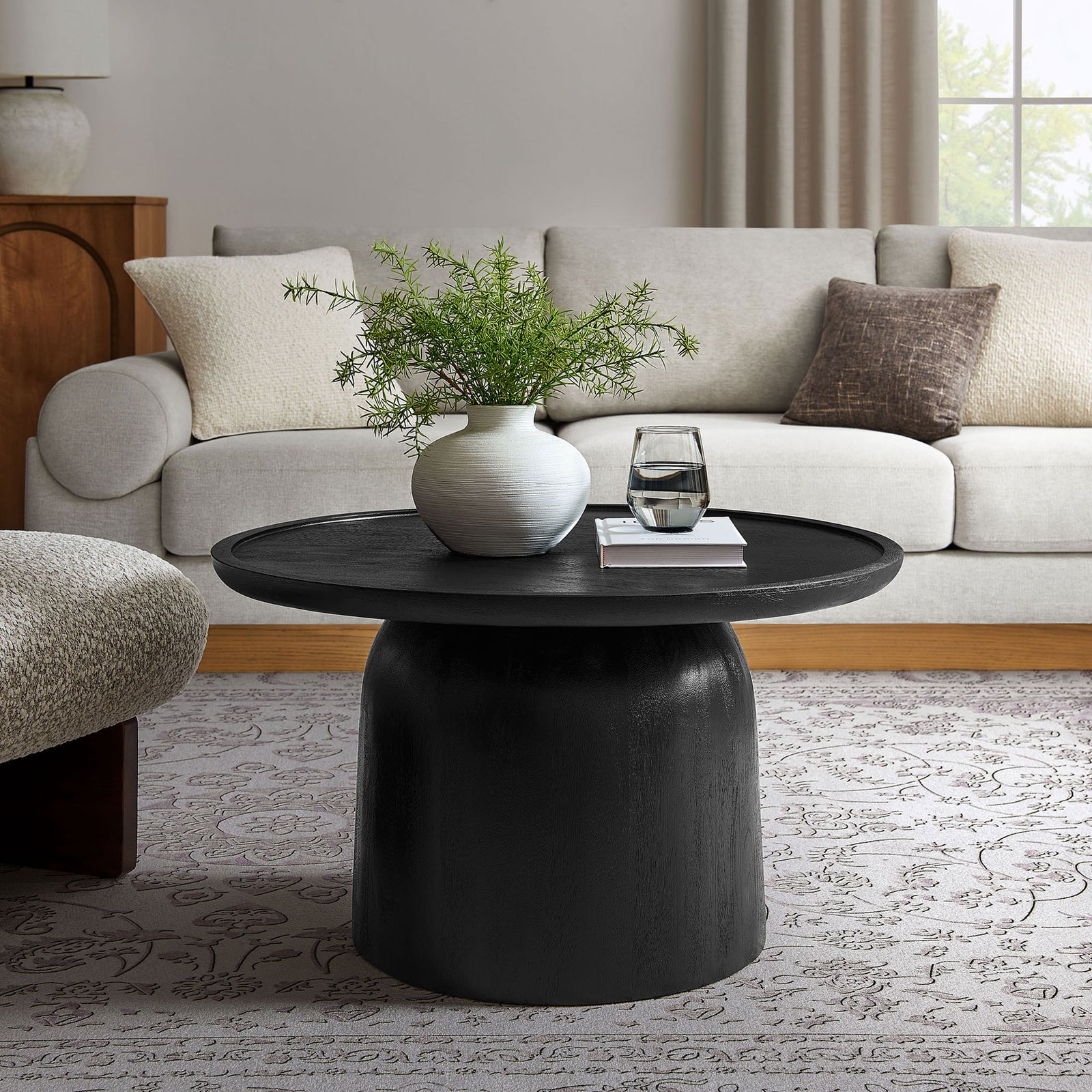 Round black mango wood coffee table with a minimalist drum profile for contemporary spaces || EEI-7144-BLK || front_room