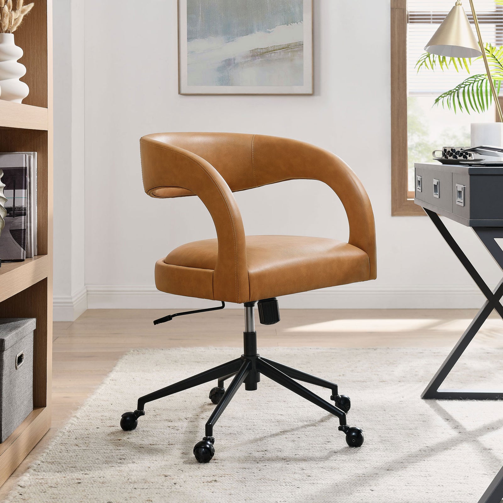 Pinnacle tan office chair bringing soft curves and warm tone to a bright home office setting || EEI-7150-TAN || front_angle_room