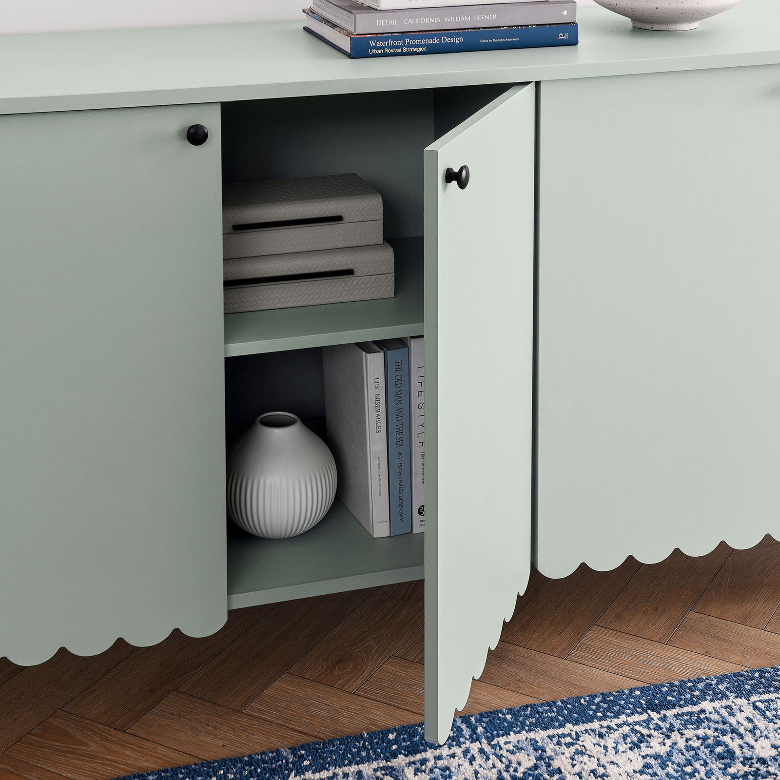 Open cabinet door showing styled shelves and neatly organized decor || EEI-7153-SGE || storage_open_room
