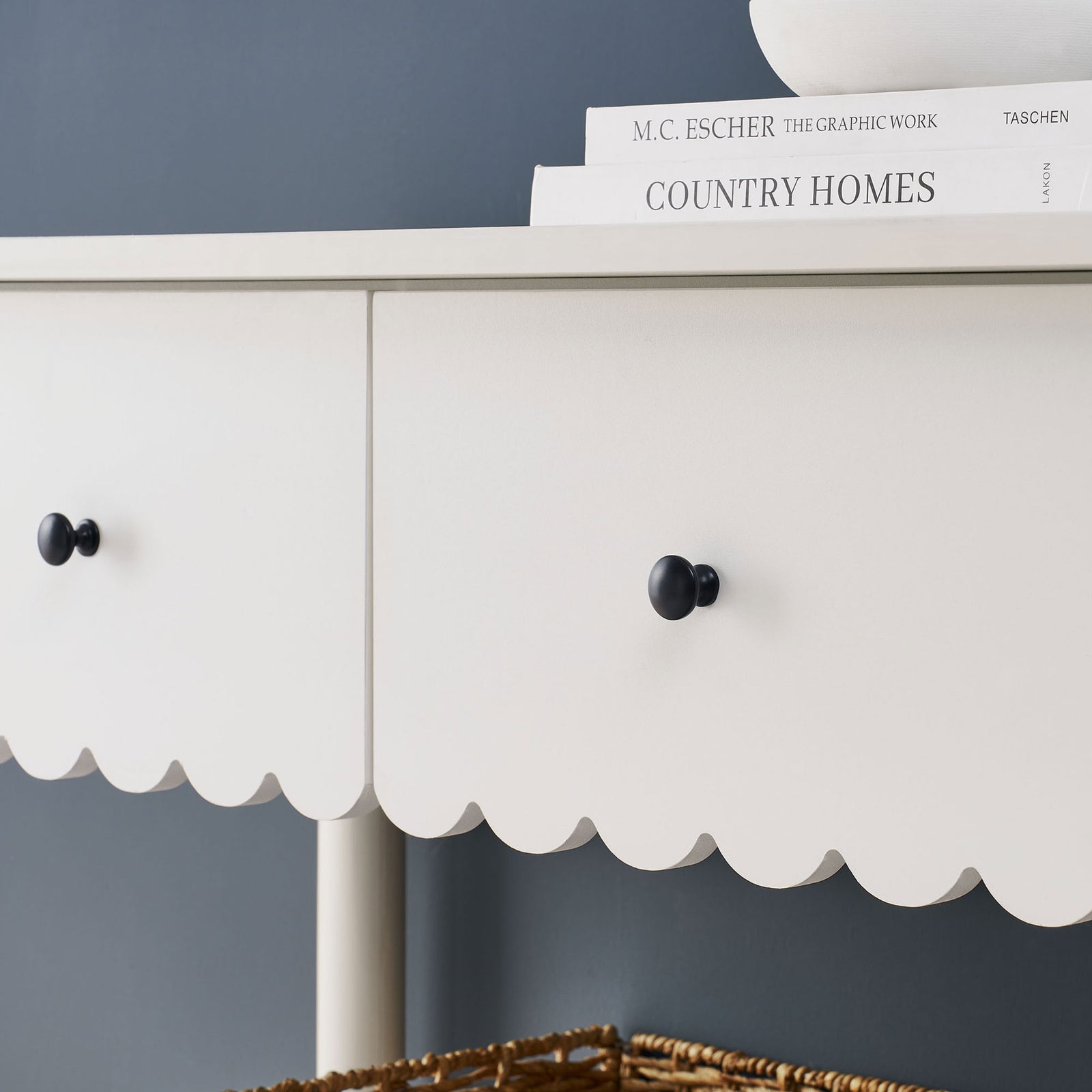 Scalloped trim pairs with matte black knobs on a smooth white finish. || EEI-7154-WHI || storage_room