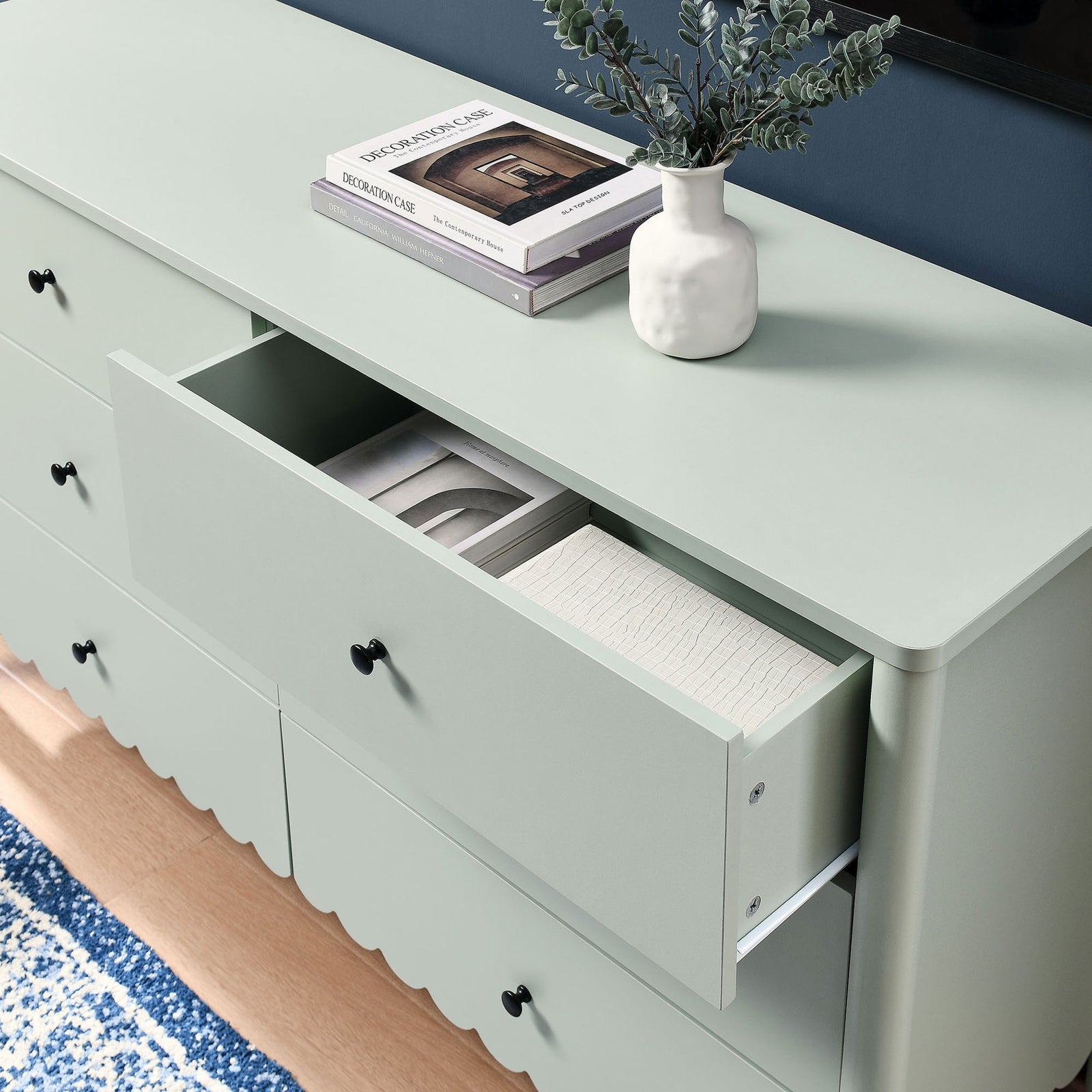 Dresser styled under a TV with decor pieces and an open drawer displaying neatly arranged accessories. || EEI-7157-SGE || storage_open_room