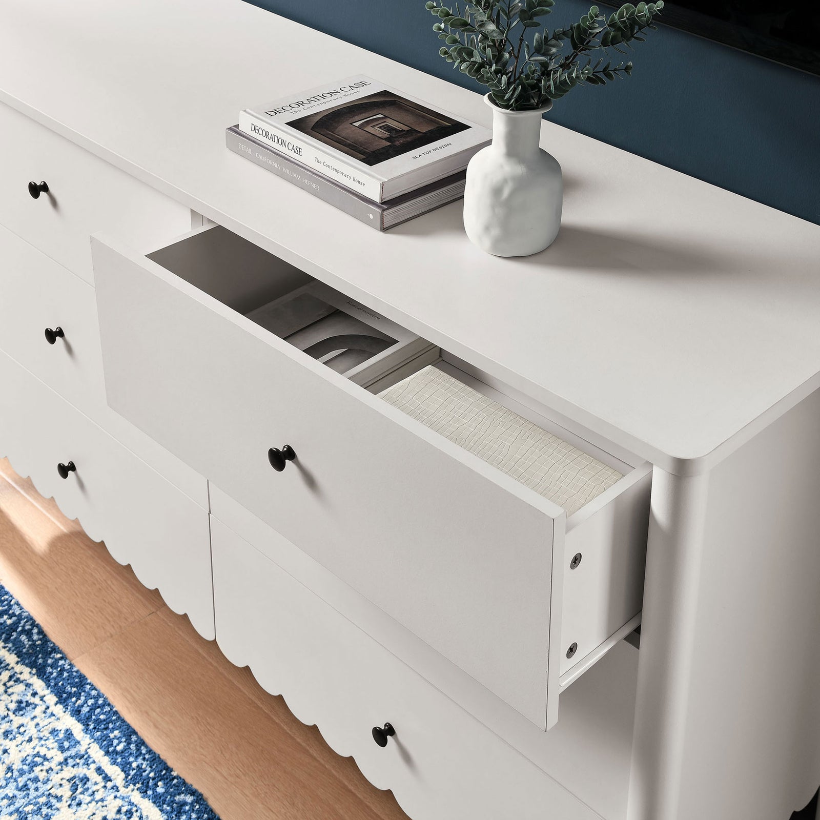 Styled dresser with open drawer doubles as a media console, organizing books and accents beneath your TV || EEI-7157-WHI || storage_open_room