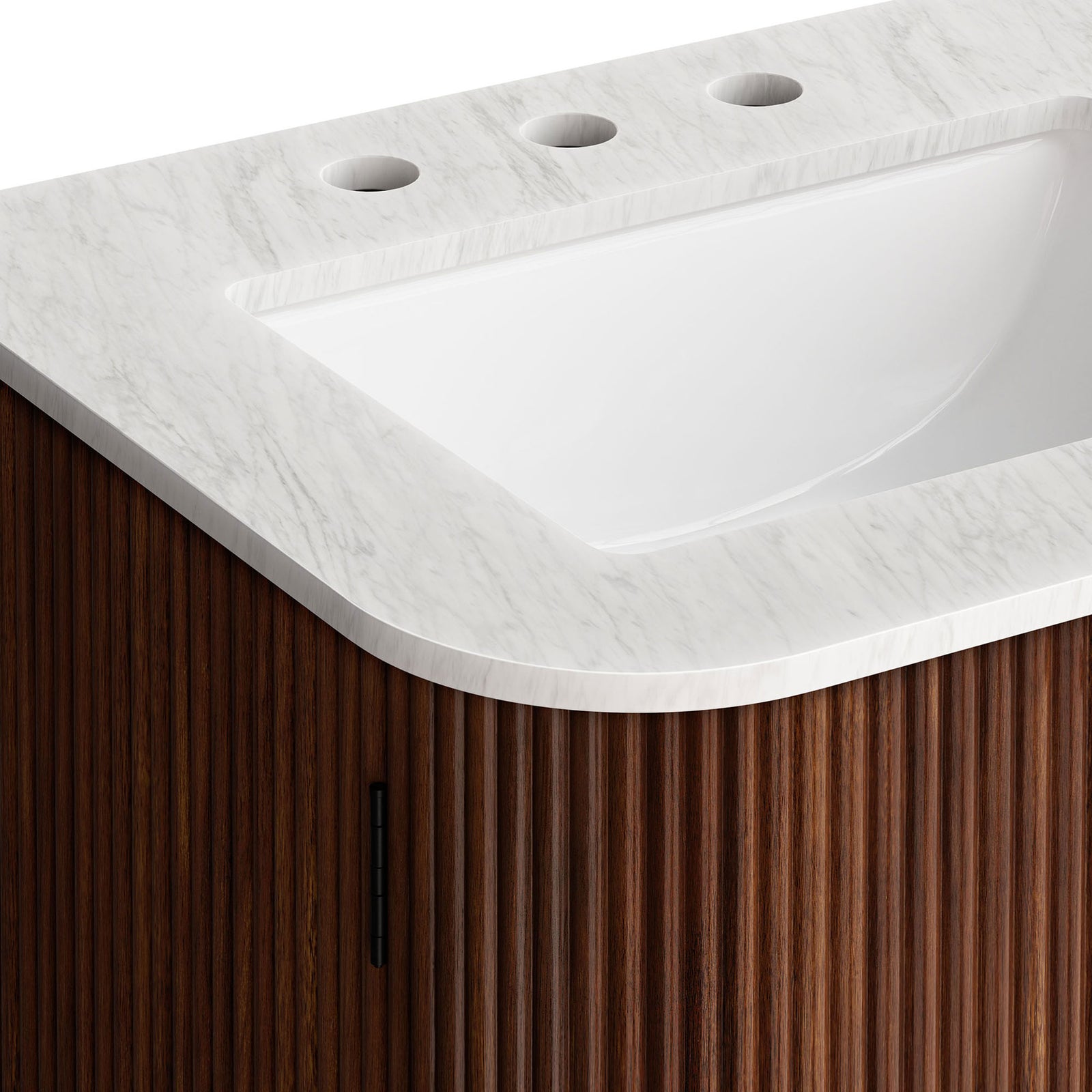 Close view of the veined marble top and softly rounded basin paired with fluted walnut cabinetry. || EEI-7162-WAL || detail_studio