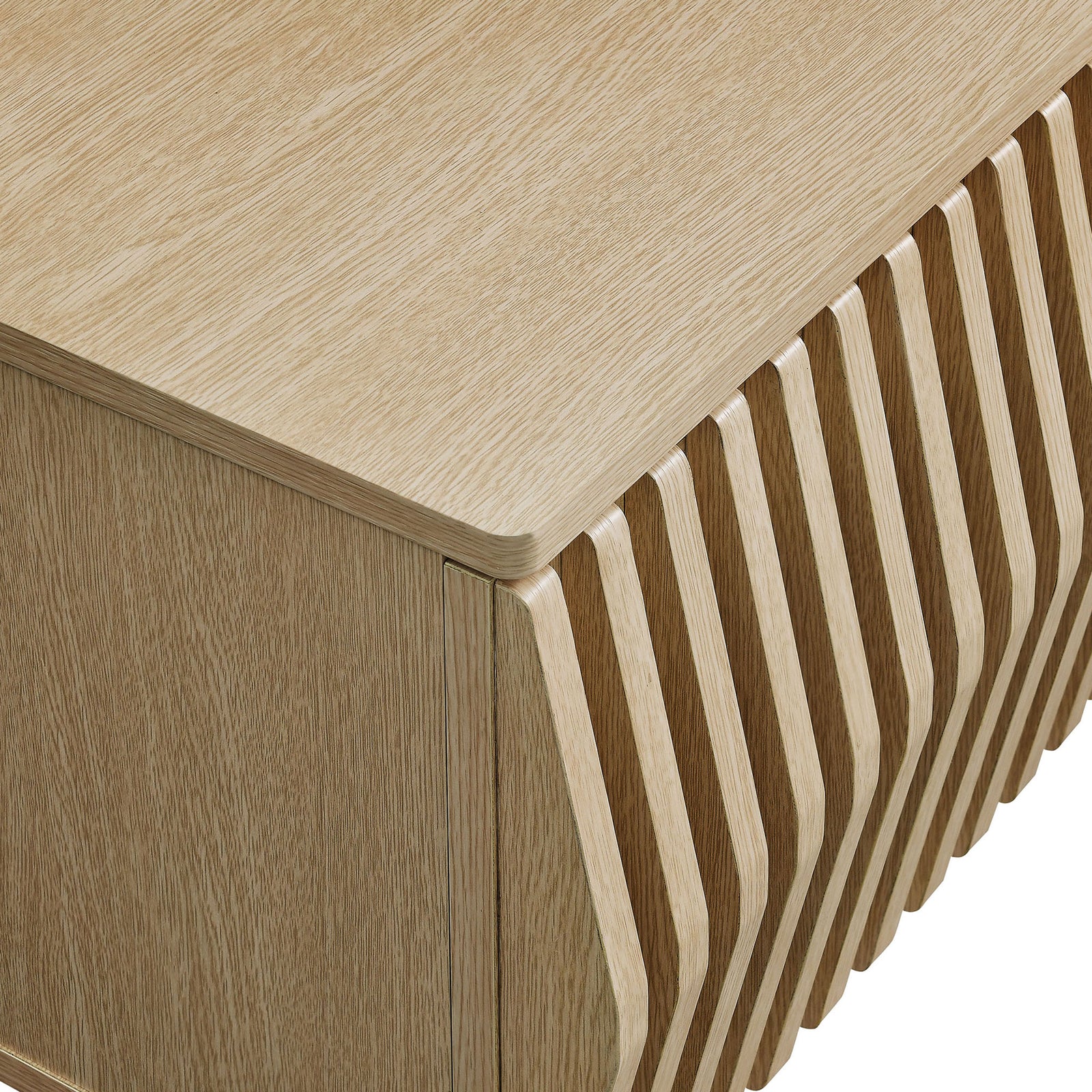 Ash TV stand corner detail highlighting rounded top edges and sculpted slatted facade || EEI-7164-ASH || detail_studio