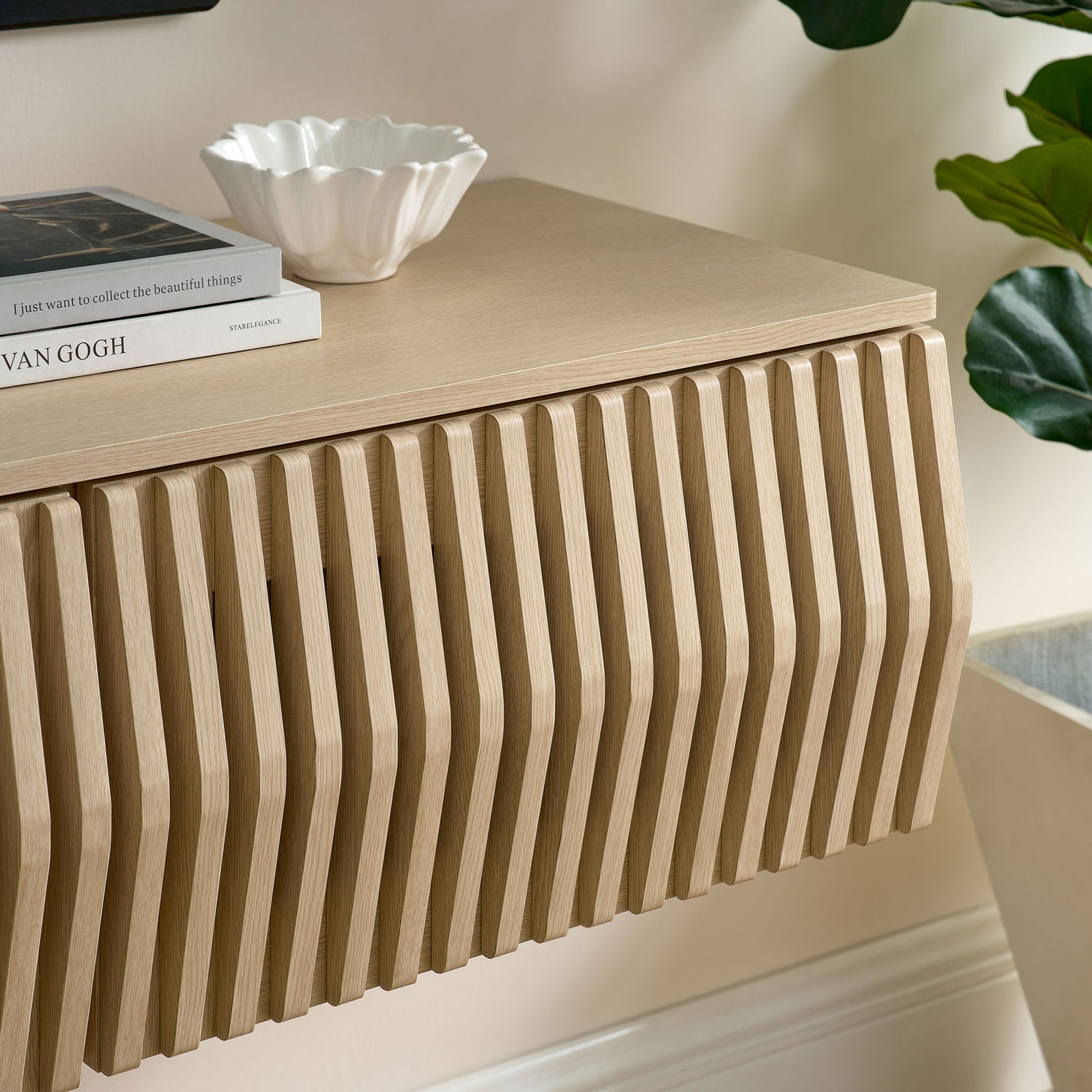 Ash TV cabinet top styled with decor accents to complement the sculpted slatted front || EEI-7164-ASH || detail_room