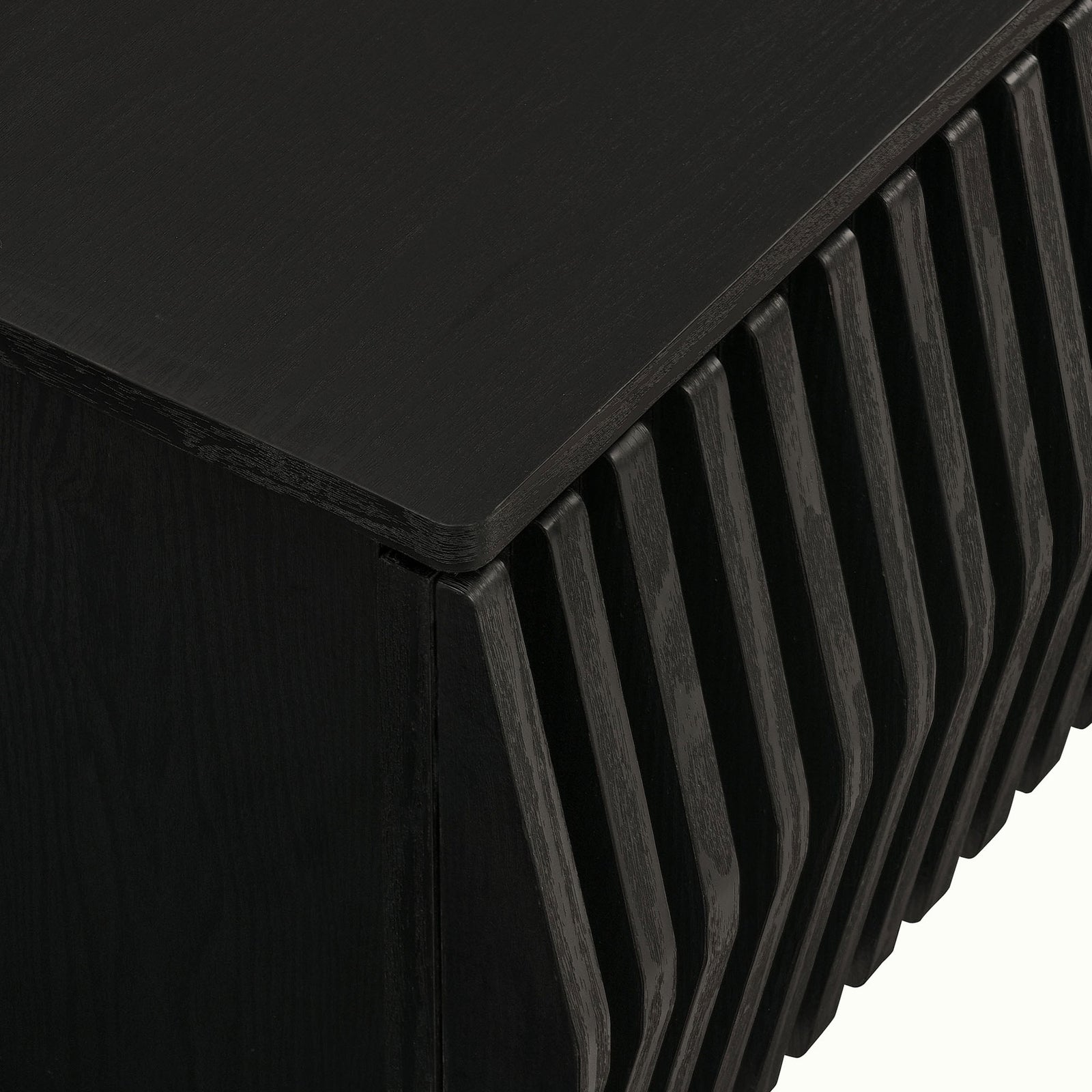Black TV stand corner detail featuring rounded top and dimensional slatted front || EEI-7164-BLK || detail_studio
