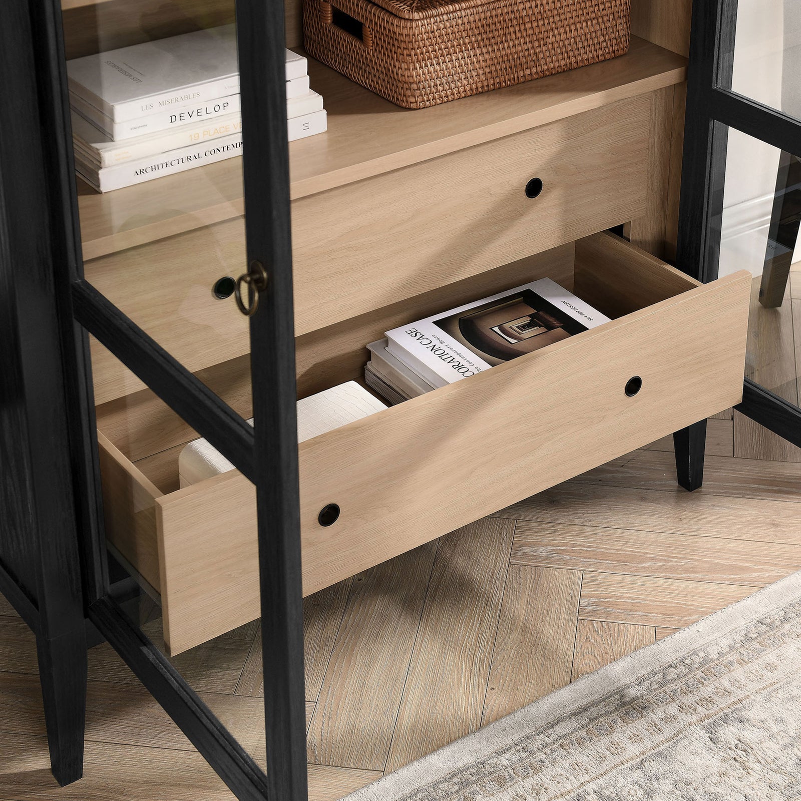 Lower drawer of the wide black oak cabinet storing books, throws, and accessories || EEI-7168-BLK-OAK || storage_open_room
