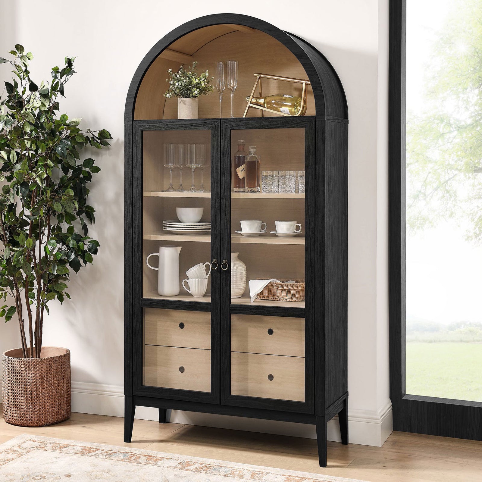 Black oak display cabinet arranged with glassware and a bar setup beside a large window || EEI-7168-BLK-OAK || front_angle_room