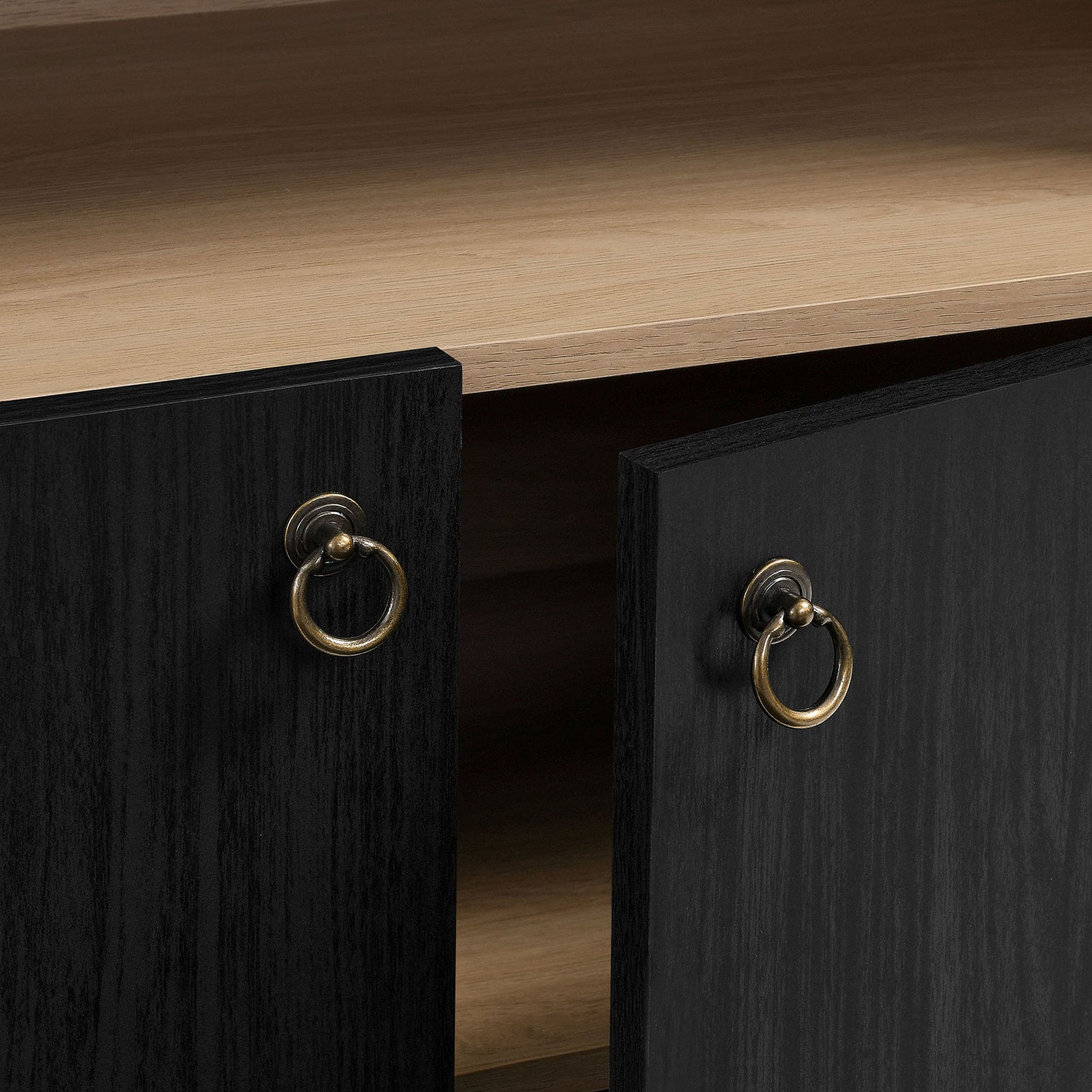Brushed gold ring pulls add a refined accent to the black oak doors || EEI-7169-BLK-OAK || handle_studio