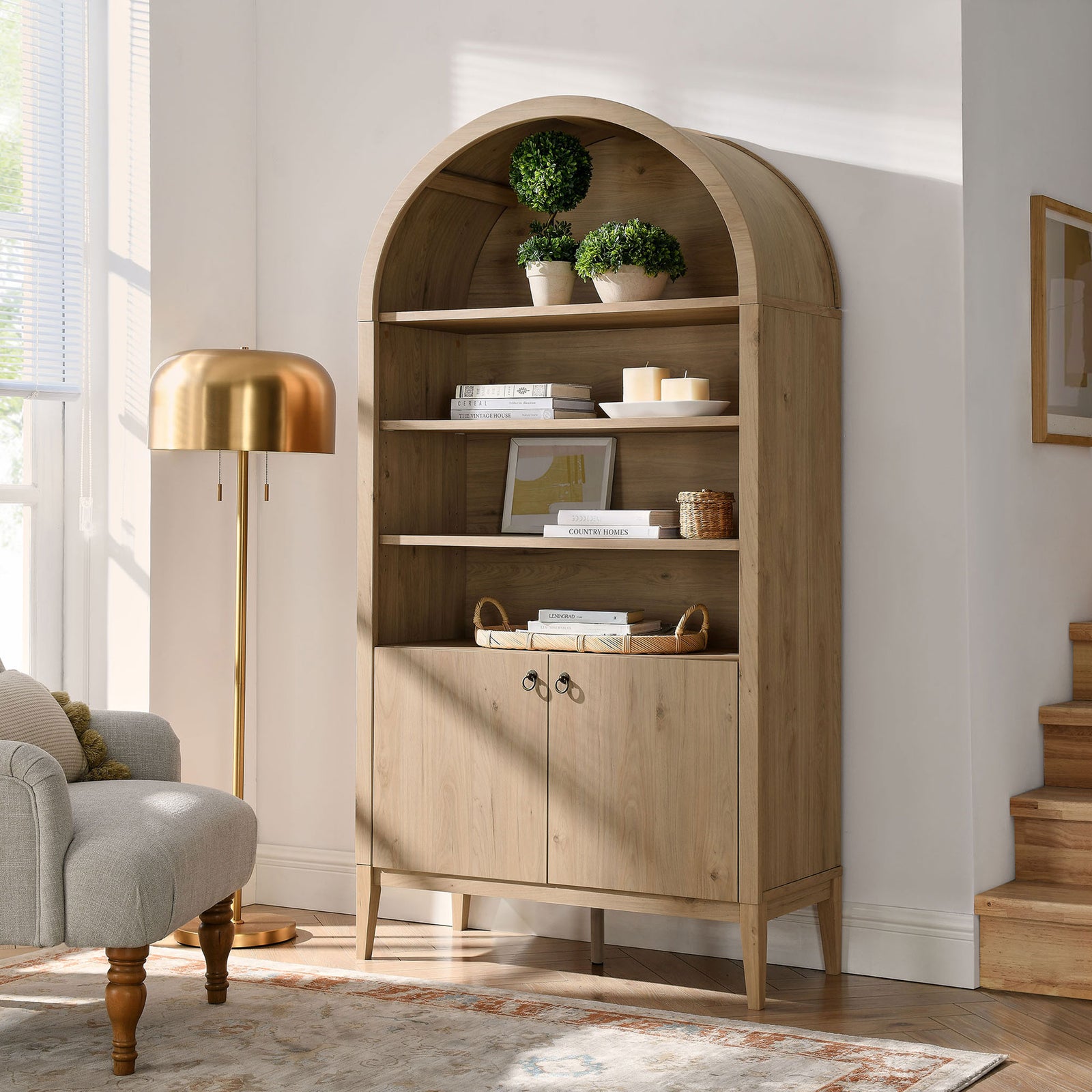 Light oak finish warms the room with generous shelving and hidden storage || EEI-7169-LOA || front_angle_room