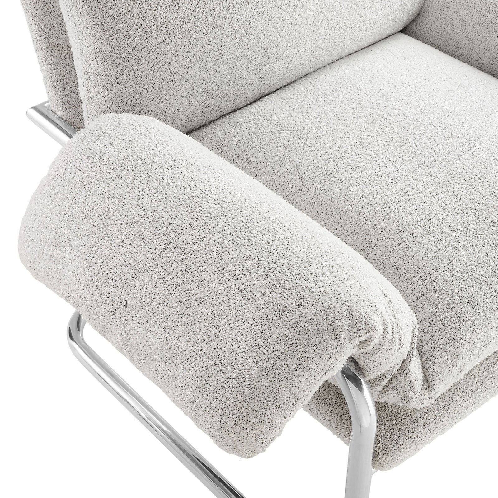 Plush boucle armrest meets smooth chrome-finished frame for cushioned comfort. || EEI-7180-NPT || detail_studio