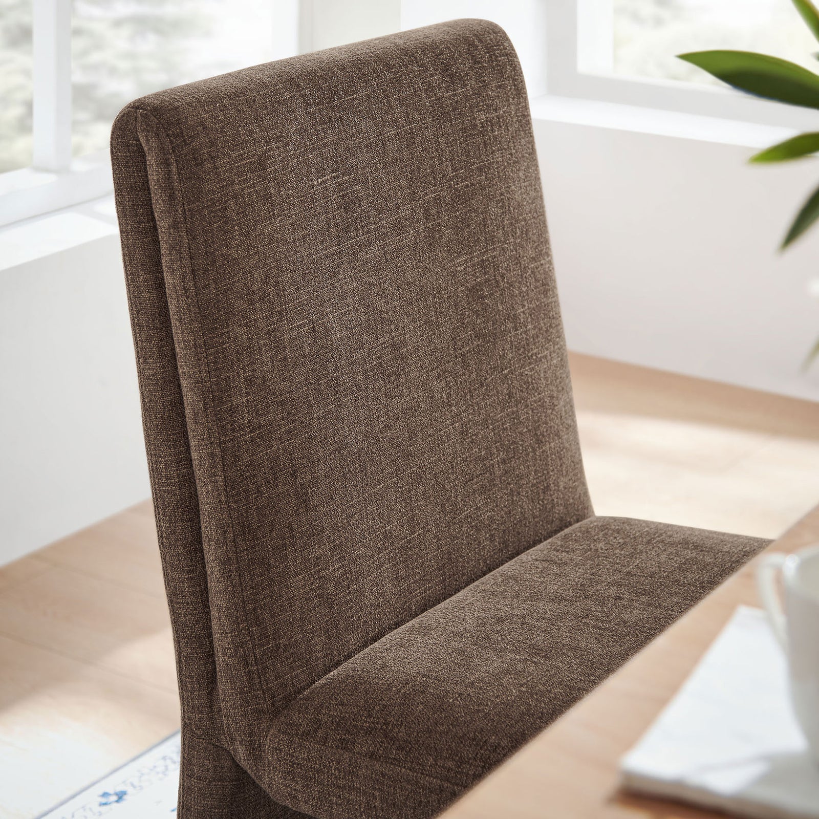 Textured mocha fabric backrest adding soft comfort at a bright dining table setting. || EEI-7185-MOC || detail_room