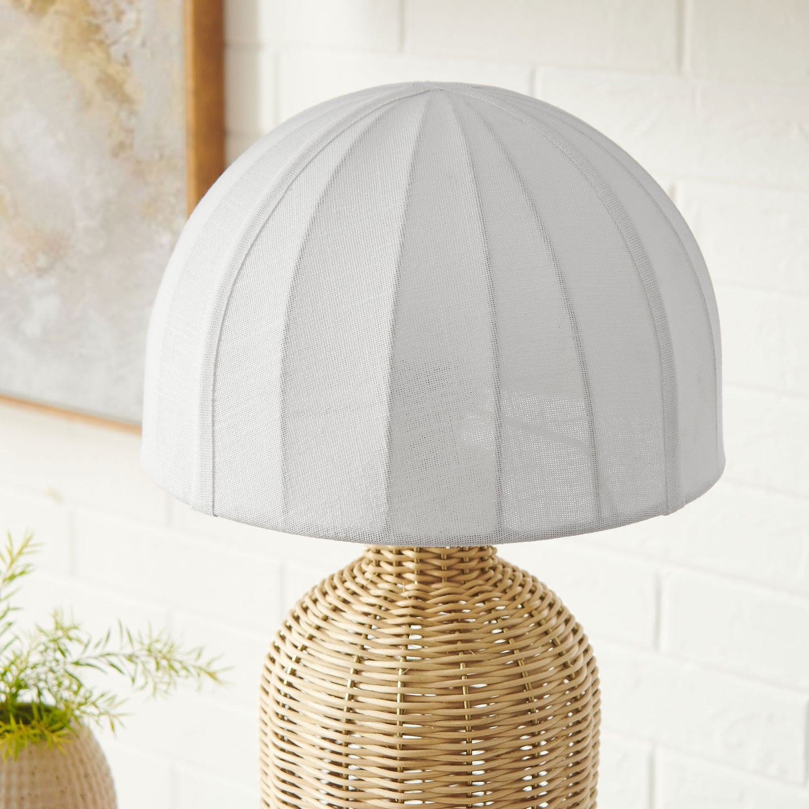 Rattan table lamp with dome shade adds soft sculptural interest on a styled console in a bright room || EEI-7186-WHI-NAT || shade_room