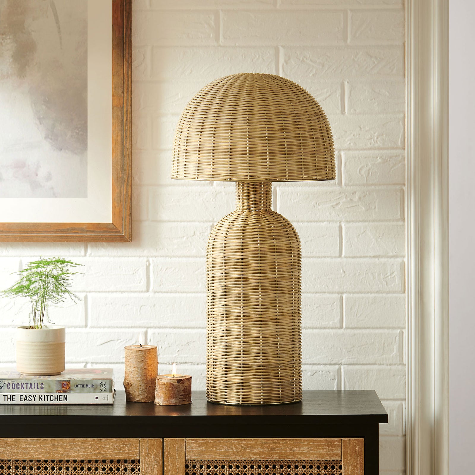 Natural rattan table lamp styled on a console table for a relaxed coastal look || EEI-7191-NAT || front_room