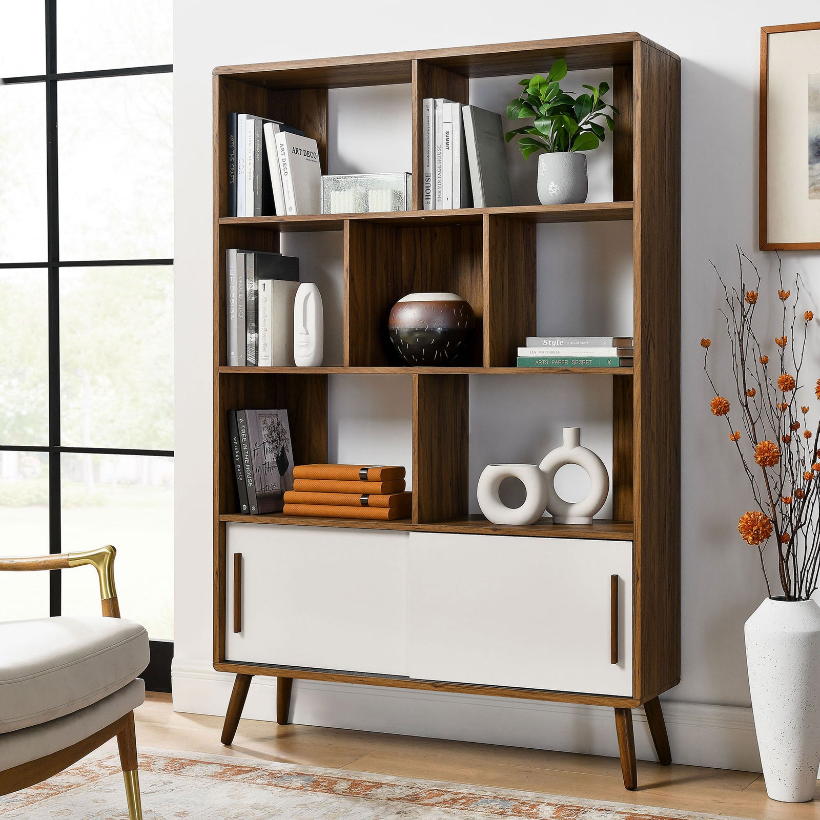 Walnut-finished bookcase elevates decor with open cubbies and clean, minimalist sliding doors. || EEI-7193-WAL-LIN || front_angle_room