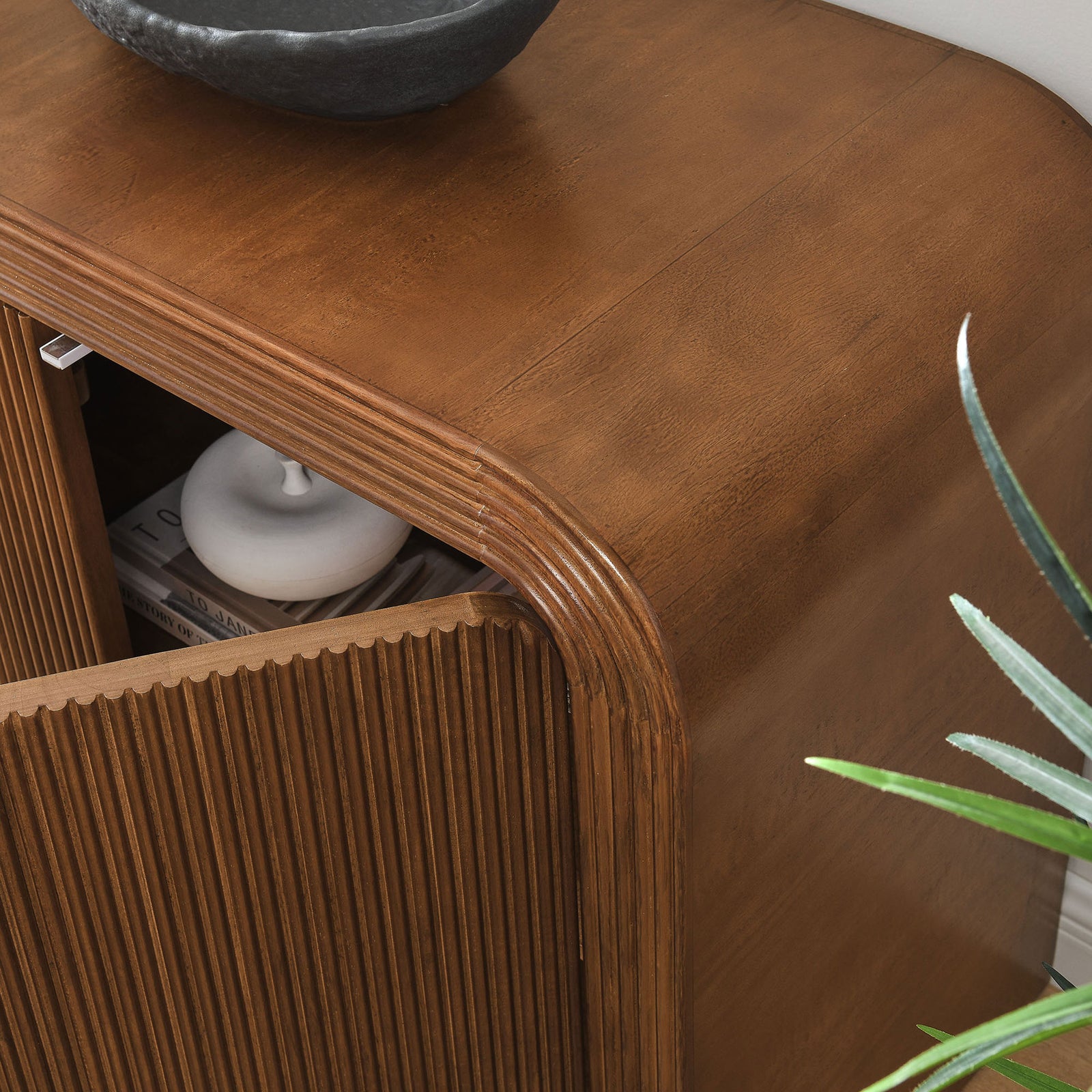 Walnut cabinet styled in a modern room, with door ajar to reveal interior shelving for concealed storage || EEI-7198-WAL || storage_open_room