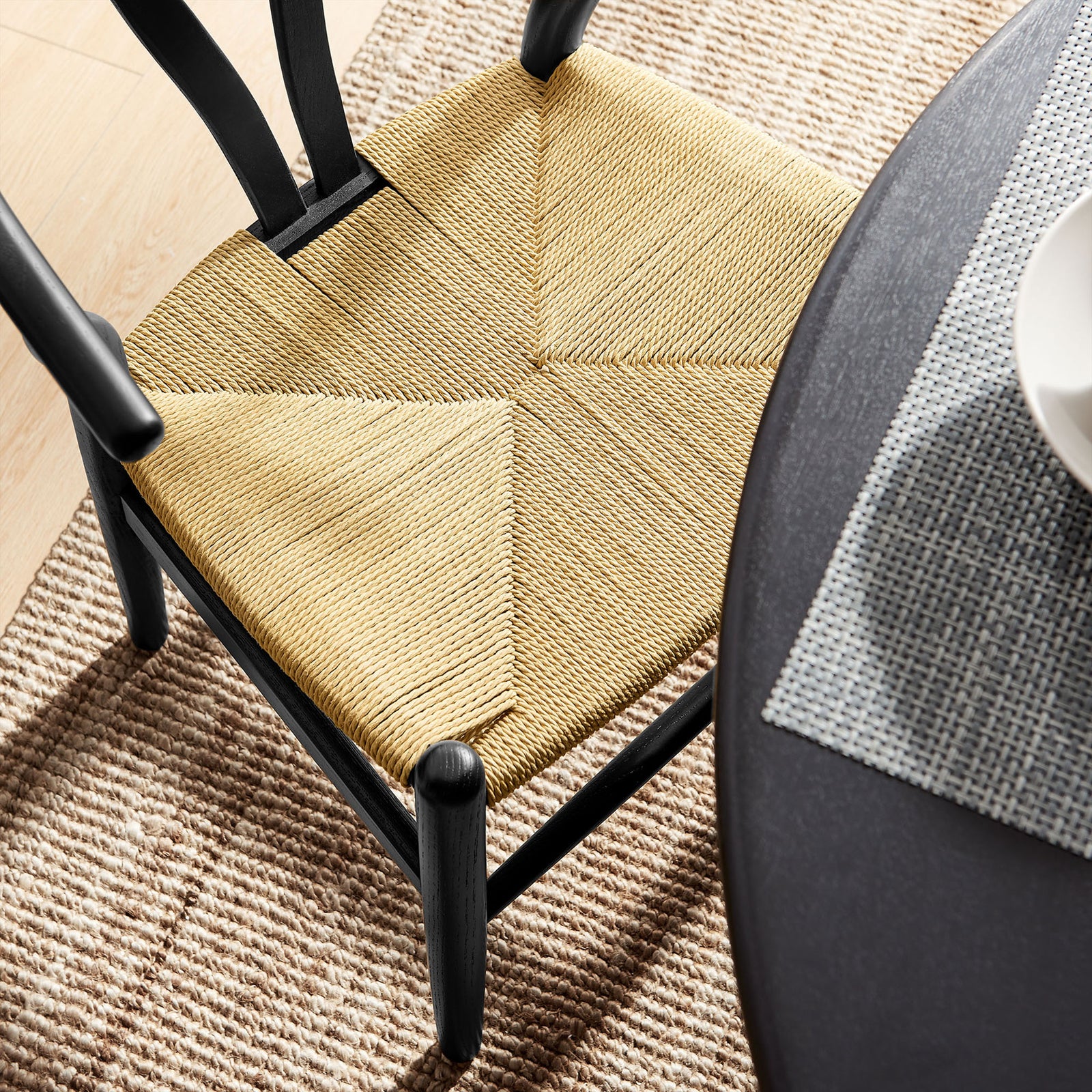 Woven rope seat pairs with dark wood frame to bring organic texture to modern dining spaces || EEI-7200-BLK || detail_room