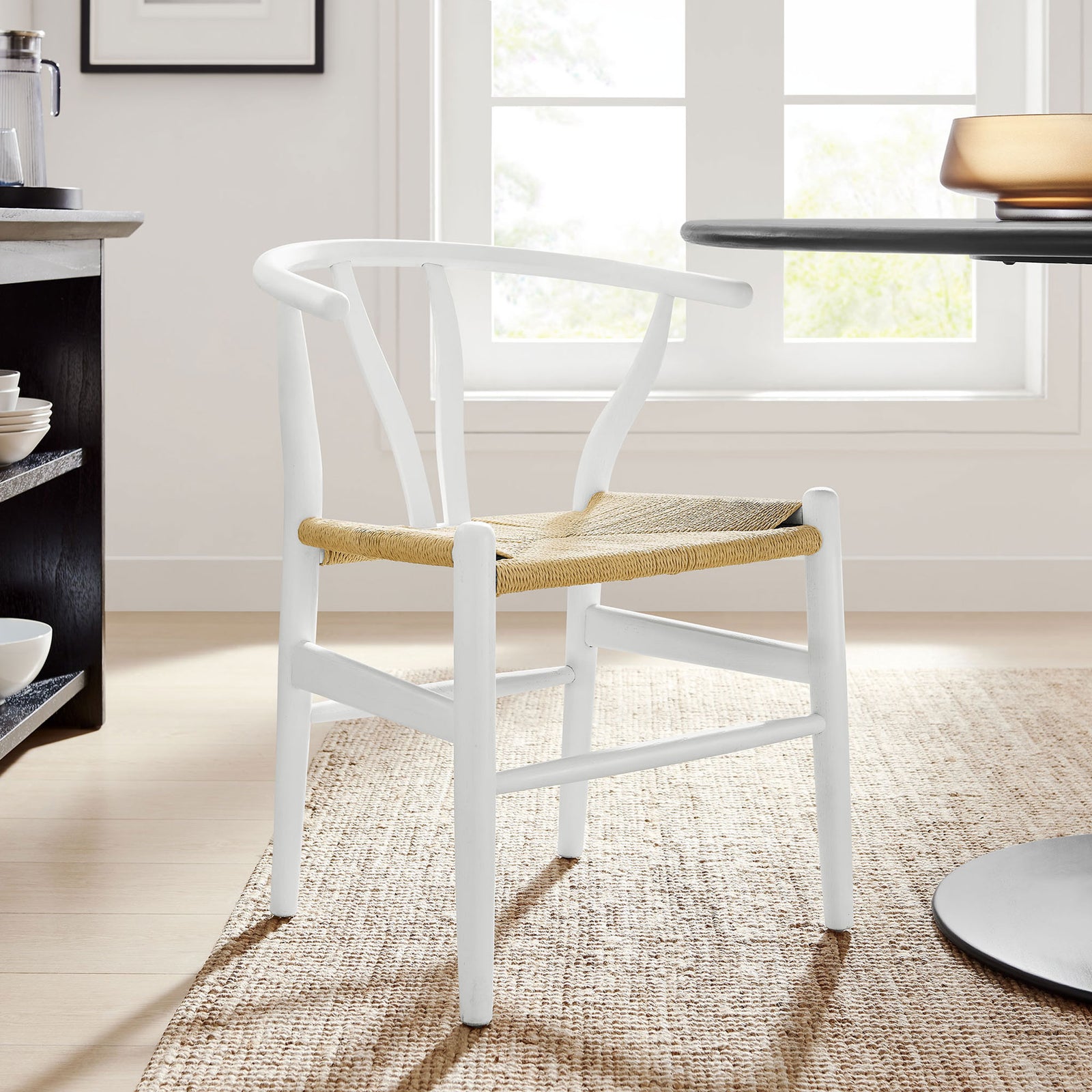 White wood dining chair with rope seat adds airy, modern warmth to a bright Scandinavian inspired dining room. || EEI-7200-WHI || front_angle_room