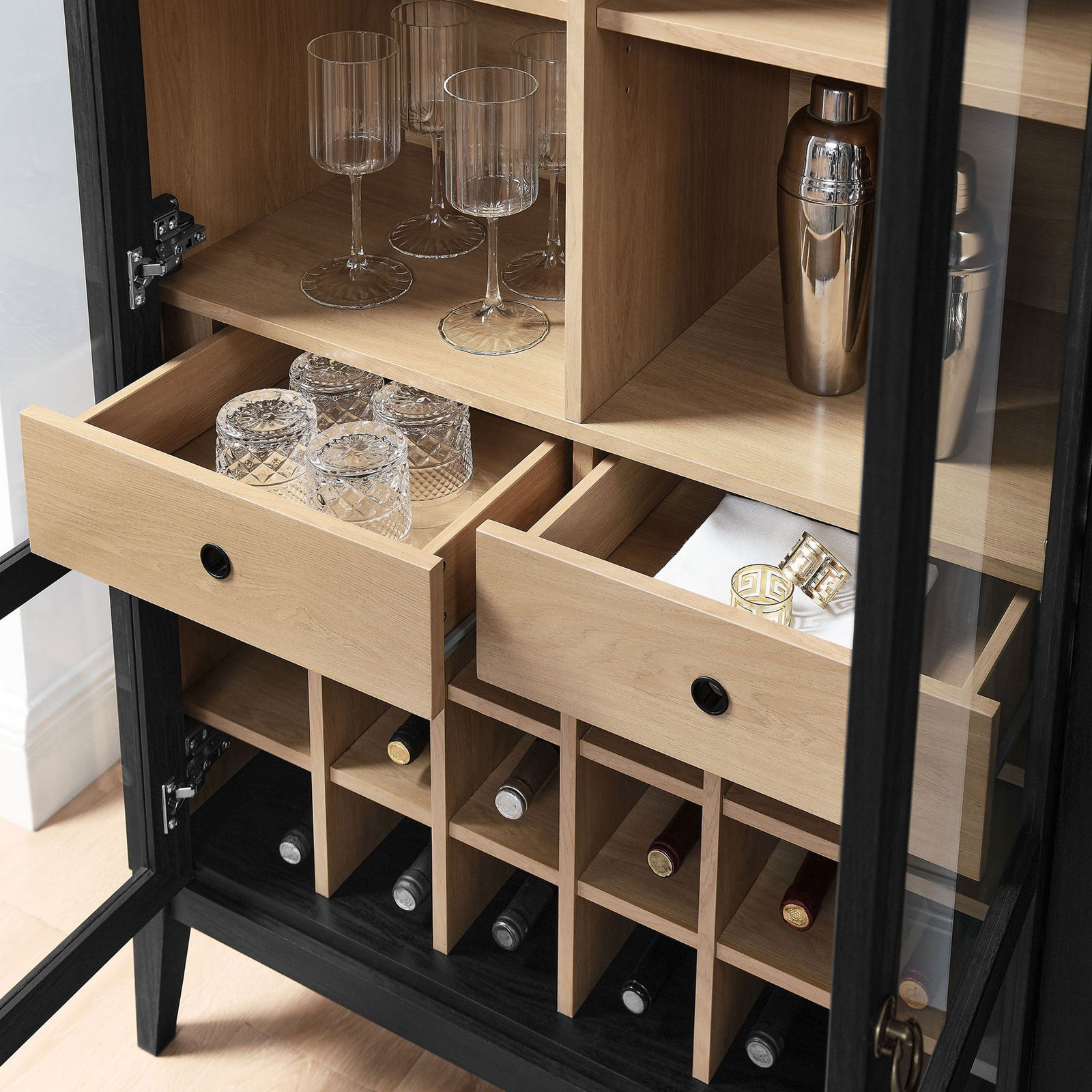 Real-life setup shows glasses, mixers, and bottles neatly arranged in the drawers and wine rack || EEI-7203-BLK-OAK || storage_open_room