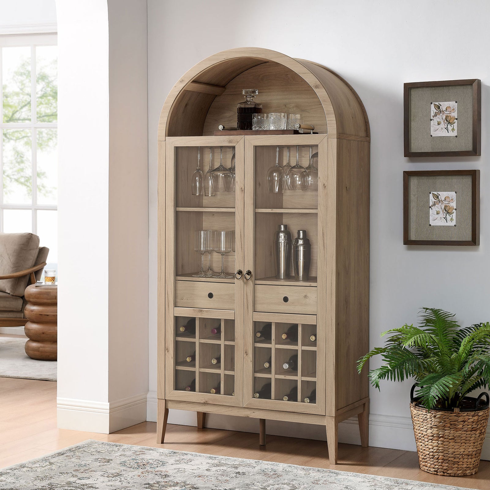 Light oak arched bar cabinet elevates the room with glass doors and built-in wine storage. || EEI-7203-LOA || front_angle_room