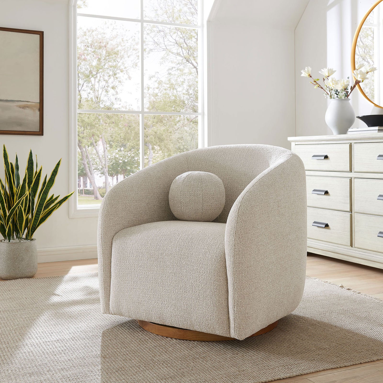 Barrel swivel chair brings soft texture and a warm wood base to a bright, airy living space. || EEI-7218-DOV || front_angle_room