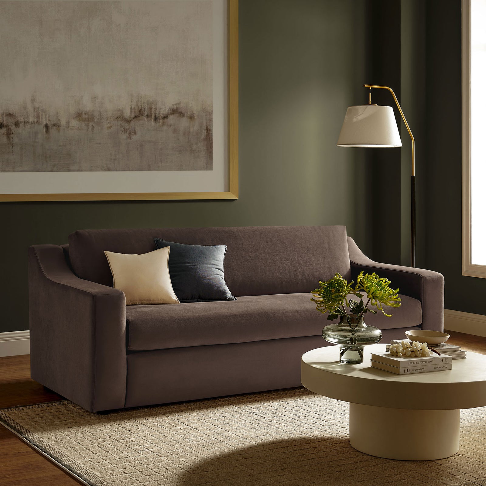 Chocolate brown velvet sofa in a modern living room with round coffee table and floor lamp || EEI-7219-CHB || front_angle_room
