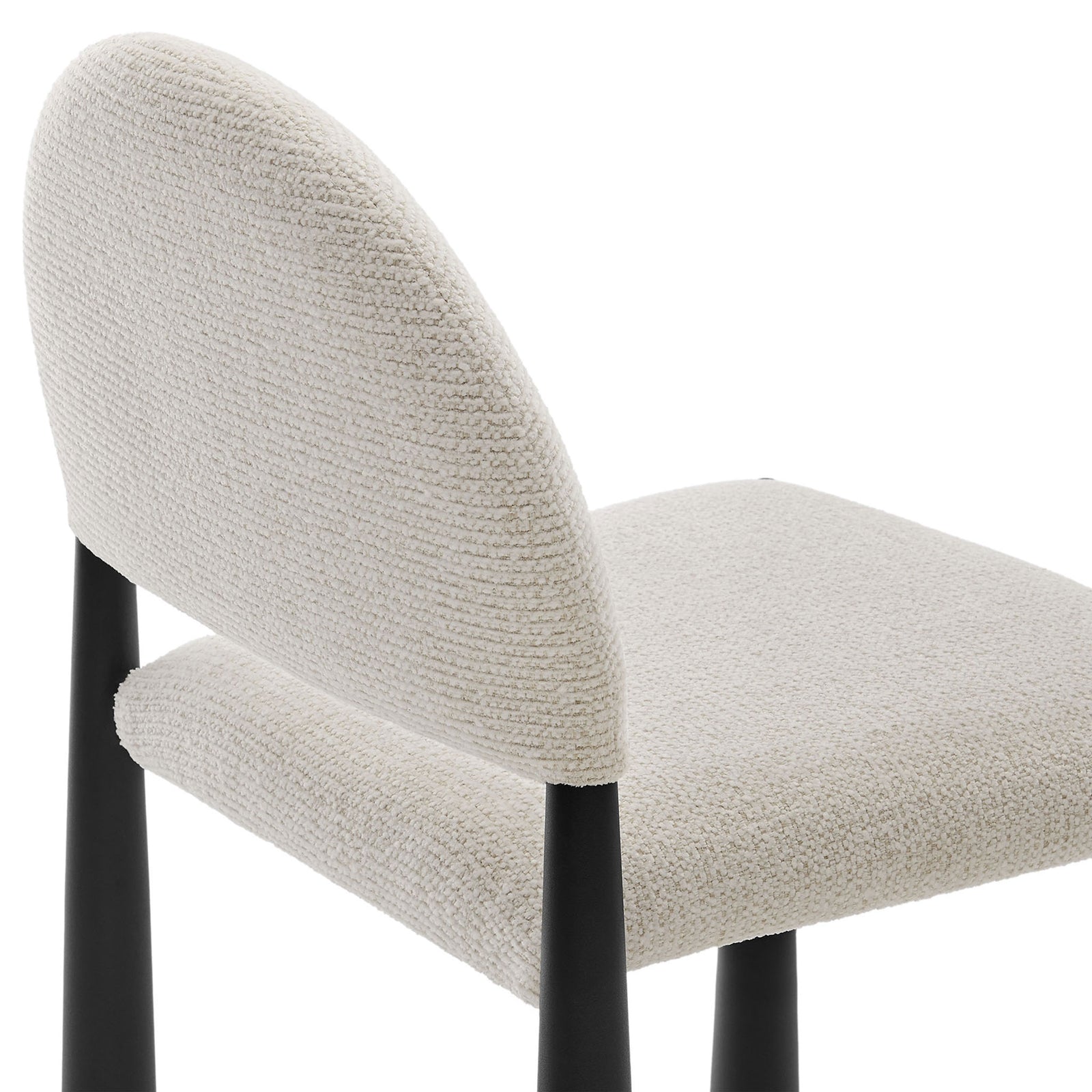 Textured cream boucle upholstery wraps the rounded back and plush seat for a soft, inviting dining chair feel || EEI-7220-BLK-CRE || detail_studio
