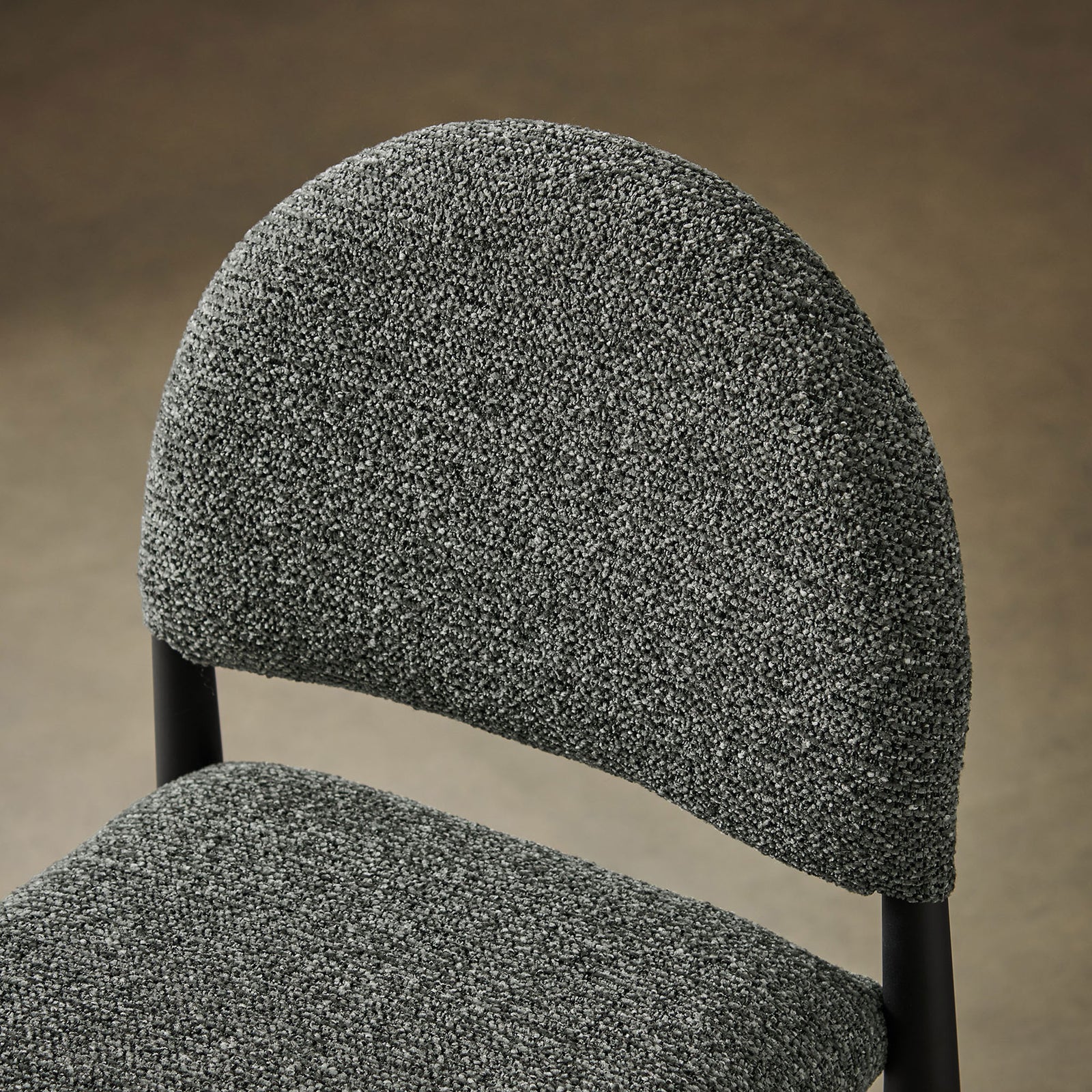 Boucle fabric and arched back bring tactile comfort and style to your counter seating. || EEI-7221-BLK-ANT || detail_room