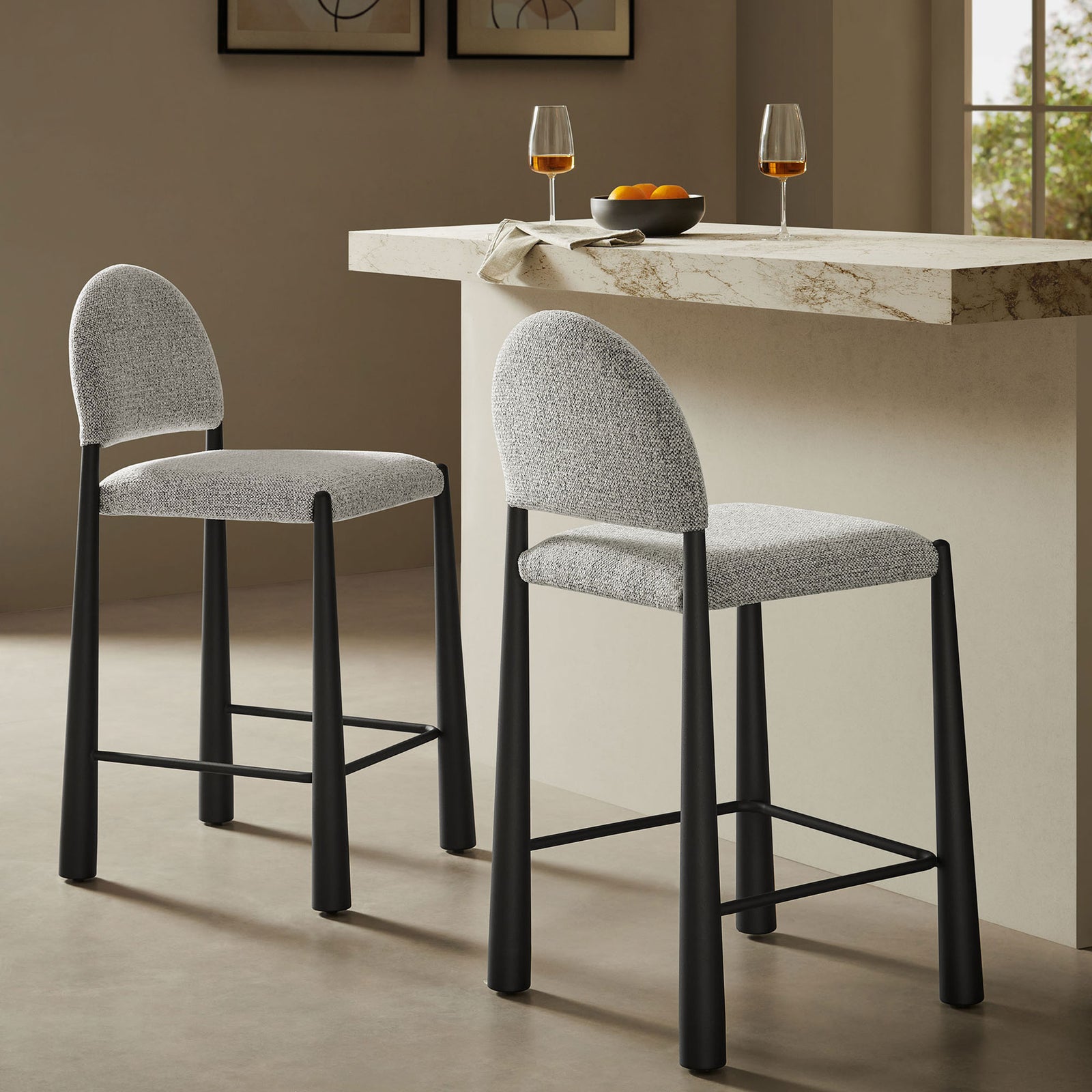 Sculptural counter stool pairs textured fabric with matte black legs for a refined look || EEI-7221-BLK-CAM || front_angle_room