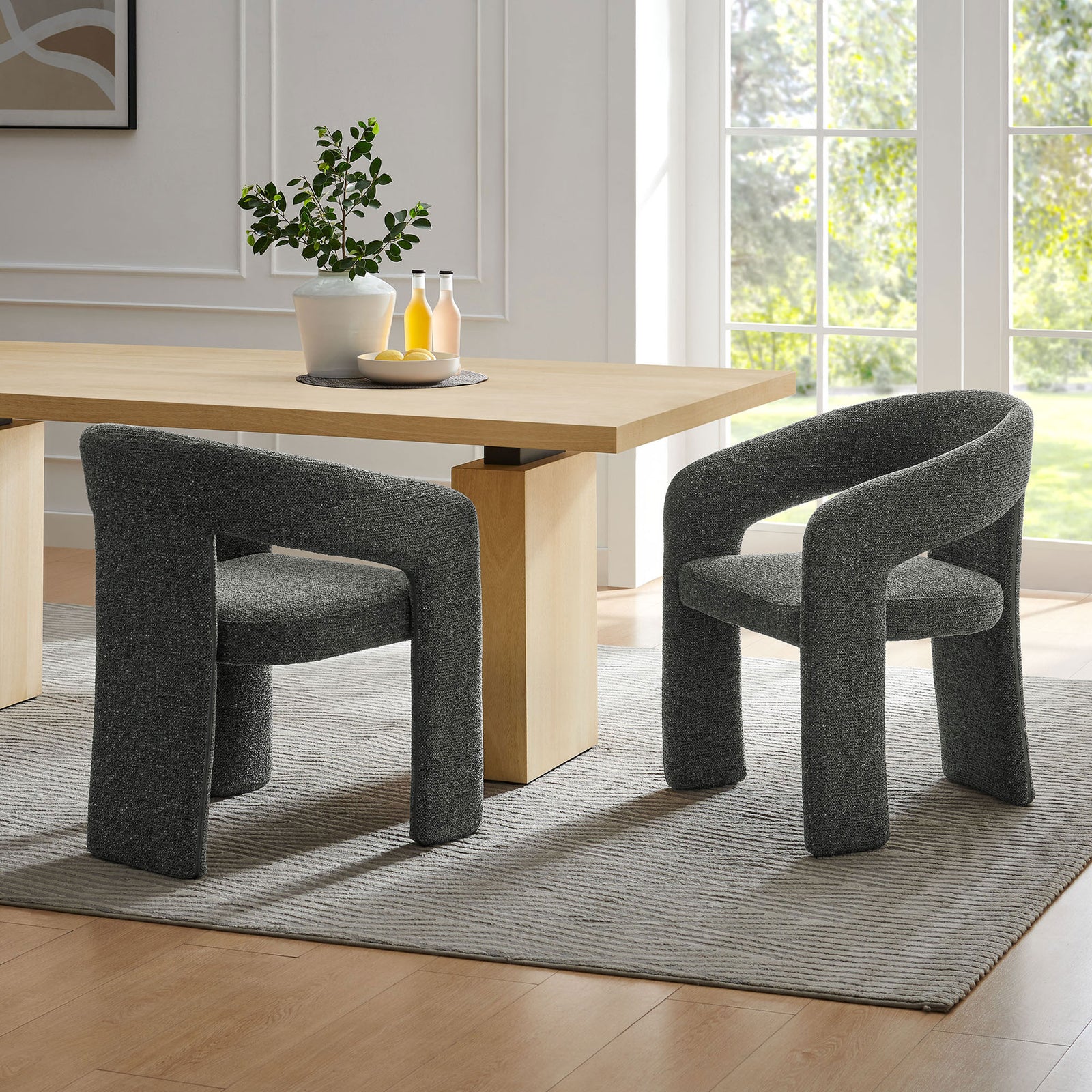 Oslo dining accent chairs in a bright modern dining room with a light wood table and large window view || EEI-7224-ANT || front_angle_room