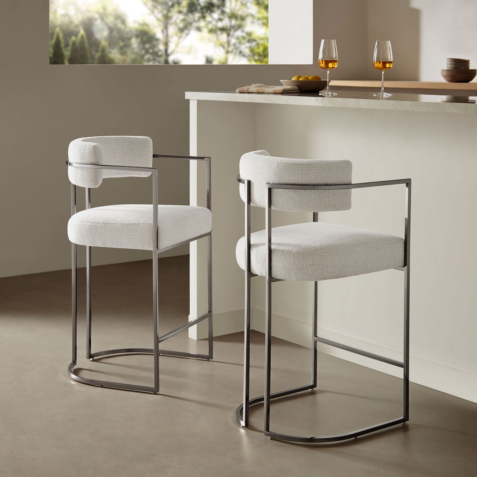Modern chrome base and cream upholstery bring soft texture and shine to your kitchen island seating. || EEI-7227-SLV-CRE || front_angle_room