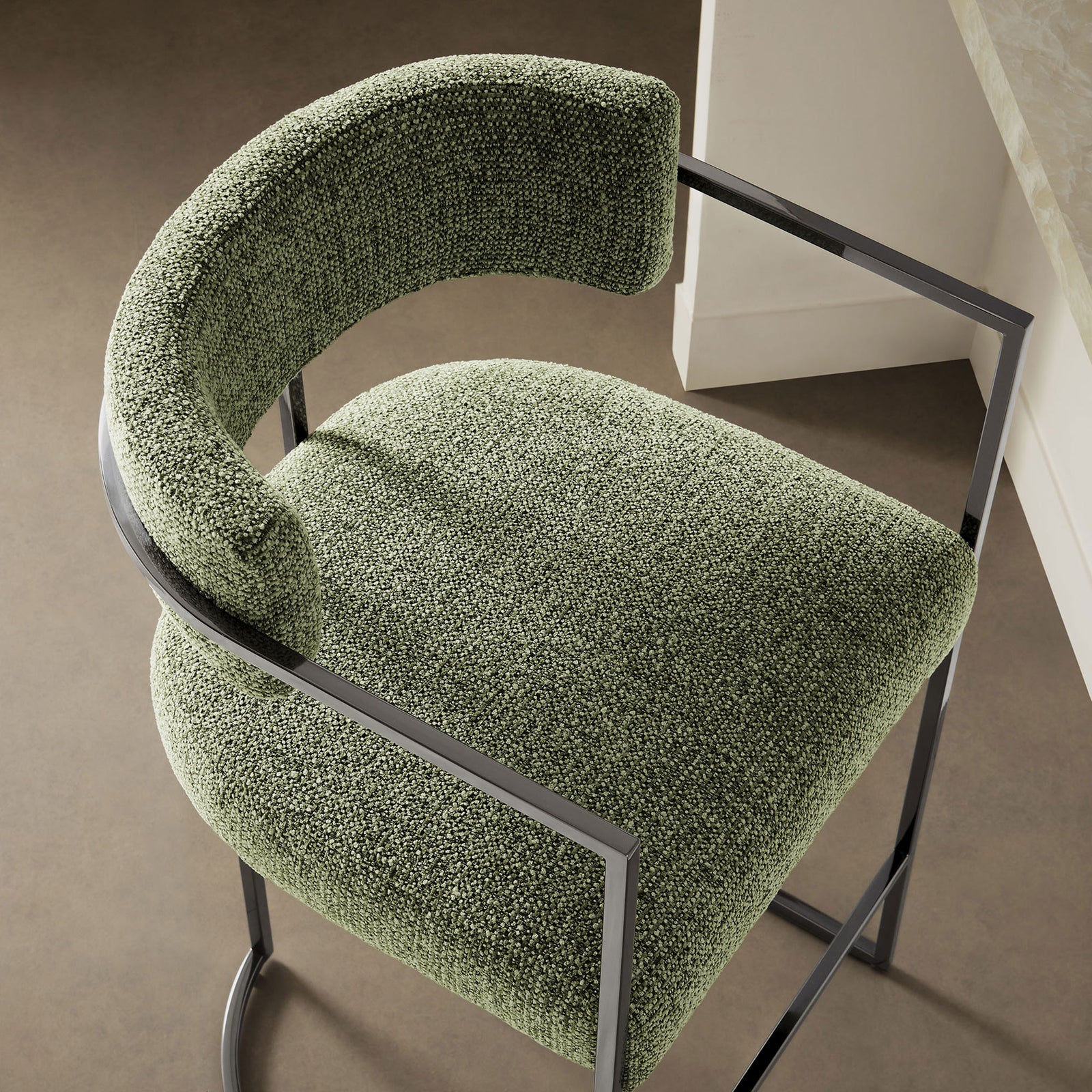 Nubby green seat and curved back offer inviting texture and support at the counter || EEI-7227-SLV-LEA || detail_room