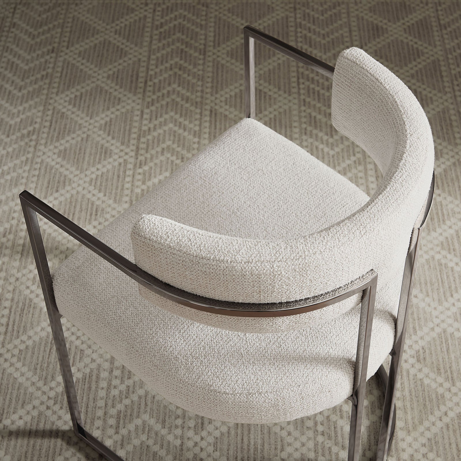 Overhead view of barrel-back chair in silver cream fabric styled on a patterned area rug || EEI-7228-SLV-CRE || top_room